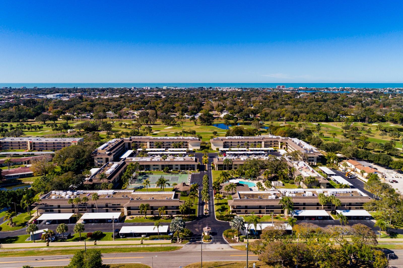 Welcome to Villas de Golf! This bright 3rd-floor condo offers stunning views of the lush Largo Golf Course and beautiful west-facing sunsets from the Florida room. The spacious two-bedroom, two-bath layout features dual en suite bedrooms and an open floor plan. For your convenience, the building includes an elevator, easy access to the laundry room down the hall, an extra storage closet, and a front-row covered parking spot. Villas de Golf is a desirable 55+ community known for its fantastic amenities — including a heated pool, clubhouse, pickleball, shuffleboard, and tennis courts. Golfers will love the convenience of Largo Golf Course right next door, making it easy to enjoy that perfect Florida lifestyle. Located just 5 minutes from Indian Rocks Beach, 35 minutes to downtown St. Pete, and close to both Tampa International and St. Pete/Clearwater airports, this condo offers the best of coastal living with easy access to everything you love. Come make this your own piece of paradise!