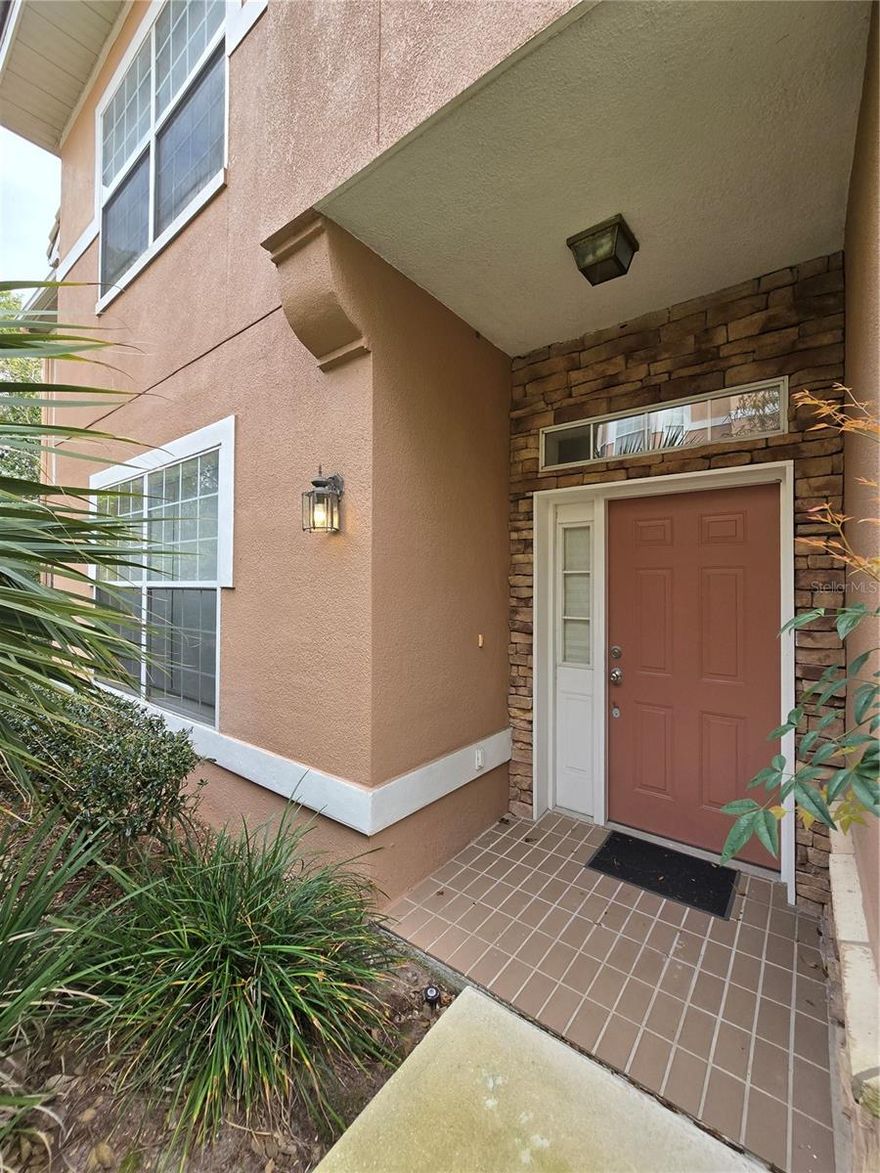 Very well maintained, one owner, 2 bed, 2 bath, ground level NO STAIRS, large kitchen with barstool seating, eat in space as well as a separate dinette. Light n bright with lots of big windows. very large bedrooms, lots of closet space and storage, inside laundry, washer and dryer included. Screened in patio backs up to wooded area. No rear neighbors. Private driveway, one car garage. Gated community with pool, social areas in clubhouse with fitness equipment. Quiet tree lined streets in the highly desirable Dr. Phillips area. Easy access to I-4, LBV, 528,  417, Restaurant Row, Universal and Disney. Welcome Home!!