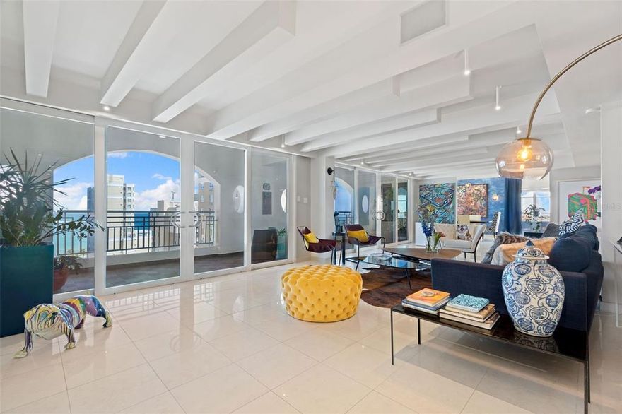 Dashing, elegantly fun and harmonious are some of the ambiances which seamlessly intersect throughout this 5,240sf contemporary dwelling occupying the whole twelfth floor of Marymar condominium.    As you step in the unit´s private landing, serenity and comfort are reflections of the versatility conveyed by the top-notch interior design plan.  Infinite moods can be provoked while you enjoy the intimacy of daily family living as well as the good fortune to be shared with extended family members and friends. You definitely have parking for them with six independent parking spaces under your belt!   All will attest your fortunate catch of a home with such high grade quality and master workmanship in all its components.  Among other things, the property boosts visual and sound systems to match the settings, ample storage in the unit´s same floor, three out of the five bedrooms are ensuite (one set up as an office with built in furnishings), sharp and efficiently designed walk-in closets, and electric rolling shutters in all windows and glass doors to lock down in ease and speedily fly away to your gateways.  But let's first settle in and enjoy the views...