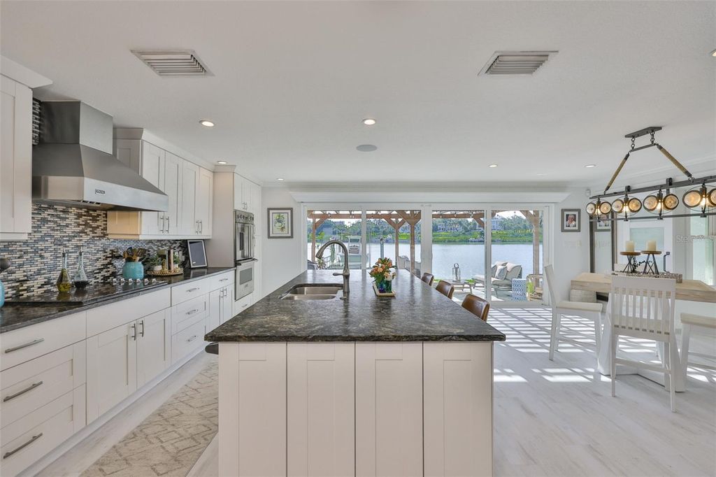 Photo of 101 Poinciana Lane, Largo, FL 33770 (MLS # TB8407796)