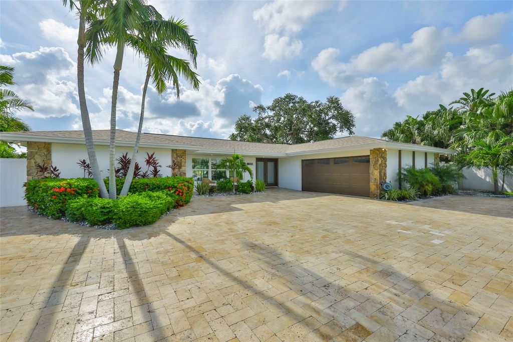 Photo of 101 Poinciana Lane, Largo, FL 33770 (MLS # TB8407796)