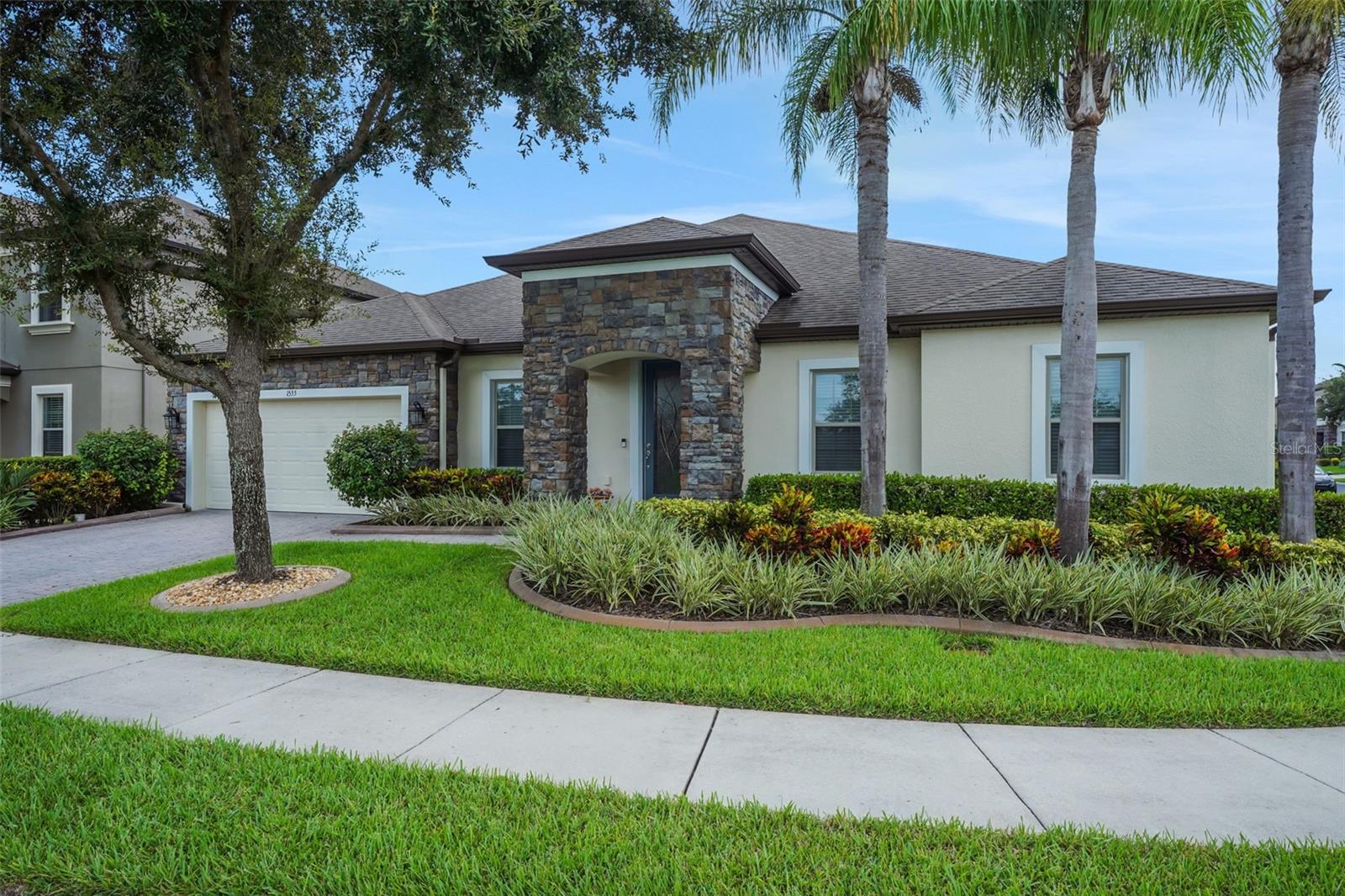 Paradise found in sought-after Estates at Pearl Lake. Desirable one-level home on a corner lot with new SPARKLING POOL and summer kitchen. This elegant & energy-efficient 4BR/3.5BA PLUS den & media room. Impeccably maintained and thoughtfully upgraded, this home offers comfort and quality at every turn. Enjoy pure, softened water throughout with a whole-house filtration and softening system along with intricate HVAC air purifier installed for clear air year round. The gourmet kitchen features premium Bosch refrigerator and dishwasher, while the laundry room is equipped with top-of-the-line Speed Queen washer and dryer. Every window is dressed with sophisticated Silhouette coverings, creating a refined and cohesive look while allowing just the right amount of natural light. This residence impresses with stacked-stone elevation, professional landscaping, paver drive, and a spacious corner lot. The rotunda entry opens to expansive living and entertaining spaces, including an updated gourmet chef’s kitchen with oversized quartz island, GE stainless steel appliances, butler’s pantry, and formal dining. The primary suite impresses with a custom built-in master closet, providing both elegance and organization, along with a tray ceiling, custom walk-in closet, and spa-like bath with dual vanities, soaking tub, and designer shower. A tandem 3-car garage with storage completes this exceptional home's utility and function. New travertine surrounding the oversized pool adds to the luxurious Florida lifestyle, while a summer kitchen bookends the seemingly endless upgrades that friends and family will love while entertaining year-round. The bonus room affords all the space one will need for a home theater or bonus room; anything you can imagine! This tranquil community offers an unbeatable location in the heart of it all—just moments from the Seminole Wekiva Biking Trail, Lake Mary’s renowned Colonial Town Park with shopping, dining, and entertainment, and top-rated Seminole County Schools. With effortless access to I-4, SR-417, and the new SR-429/Wekiva Parkway connector, convenience meets luxury living. This is the home you’ve been waiting for! This property may be under audio/visual surveillance.