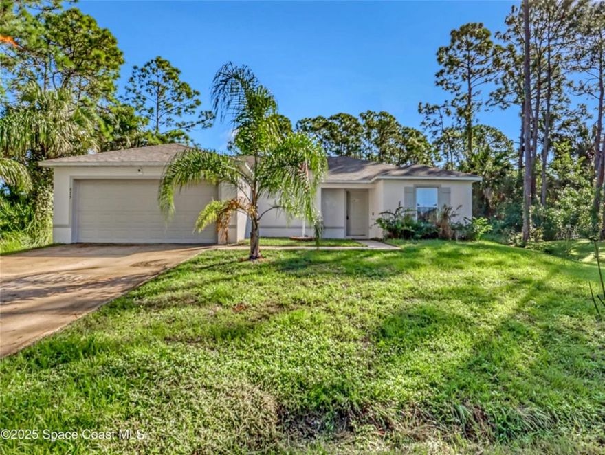 Welcome to your new home in the heart of Palm Bay. Built in 2022, this well-designed 3-bedroom,2 bath home offers modern comfort on a spacious lot. Home comes with a state of the art WATER FILTRATION system! 12k Value! Step inside to discover a bright and open floor plan, where the kitchen flows seamlessly into the dining room and great room-idea for hosting friends, family gatherings or relaxed everyday living. The breakfast bar invites casual meals, while a view into the great room keeps everyone connected. Owners' suite is thoughtfully placed with privacy and convenience in mind. Two additional well sized bedrooms share a full family bath. Located in a vibrant and growing area of Palm Bay with access to shopping, dining, schools and more!