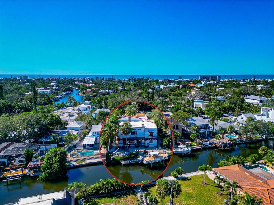 Park your Boat behind your home .... Welcome to this boaters paradise! This recently renovated 3-bedroom, 3-bathroom home nestled in the heart of Siesta Key. With 3,324 square feet of well designed living space, this contemporary home offers both luxury and comfort in one of Florida's most coveted locations. Step inside to find over-sized rooms that can be utilized for entertaining or simply unwinding after a day at the beach and boating. These multi-purpose rooms adapt to your lifestyle, whether you need another bedroom, home office, fitness space, or creative art studio. A true showstopper awaits outside, where a Lucas Lagoons designed pool transforms your outdoor living area into a resort-worthy oasis. Known for creating breathtaking aquatic masterpieces, this signature pool feature turns everyday swimming into a resort setting for entertainment. Imagine hosting poolside gatherings that friends will talk about for years to come! Sun worshippers will appreciate the large rooftop tanning area—your private perch for soaking up Florida's famous sunshine while enjoying gentle Gulf breezes. It's like having your own exclusive sundeck without the crowds. This house is the perfect balance between contemporary sophistication and vacation-like comfort. Beautiful, neutral finishes throughout create an atmosphere of elegance without sacrificing that relaxed coastal vibe that makes Siesta Key special. Location? Simply unbeatable. Situated in central Siesta Key, you're just a stroll from the bustling Siesta Key Marketplace where local shops and dining options abound. Siesta Market is less than a 10-minute walk away—perfect for picking up ingredients for an impromptu dinner or beach picnic. For those who appreciate the island's famous nightlife, Siesta Key Oyster Bar and Daiquiri Deck are within easy walking distance. Meanwhile, the world-renowned Siesta Beach—celebrated for its powder-fine white sand—is just a short bike ride from your doorstep. The primary bedroom offers a serene retreat after days filled with sunshine and adventure, while the additional bedrooms provide comfortable accommodations for family and guests. This isn't just a house—it's an invitation to embrace the laid-back yet luxurious Siesta Key lifestyle. Where morning coffee comes with water views, weekends blend into beach days, and every evening feels like a vacation. Why visit paradise when you can live there?