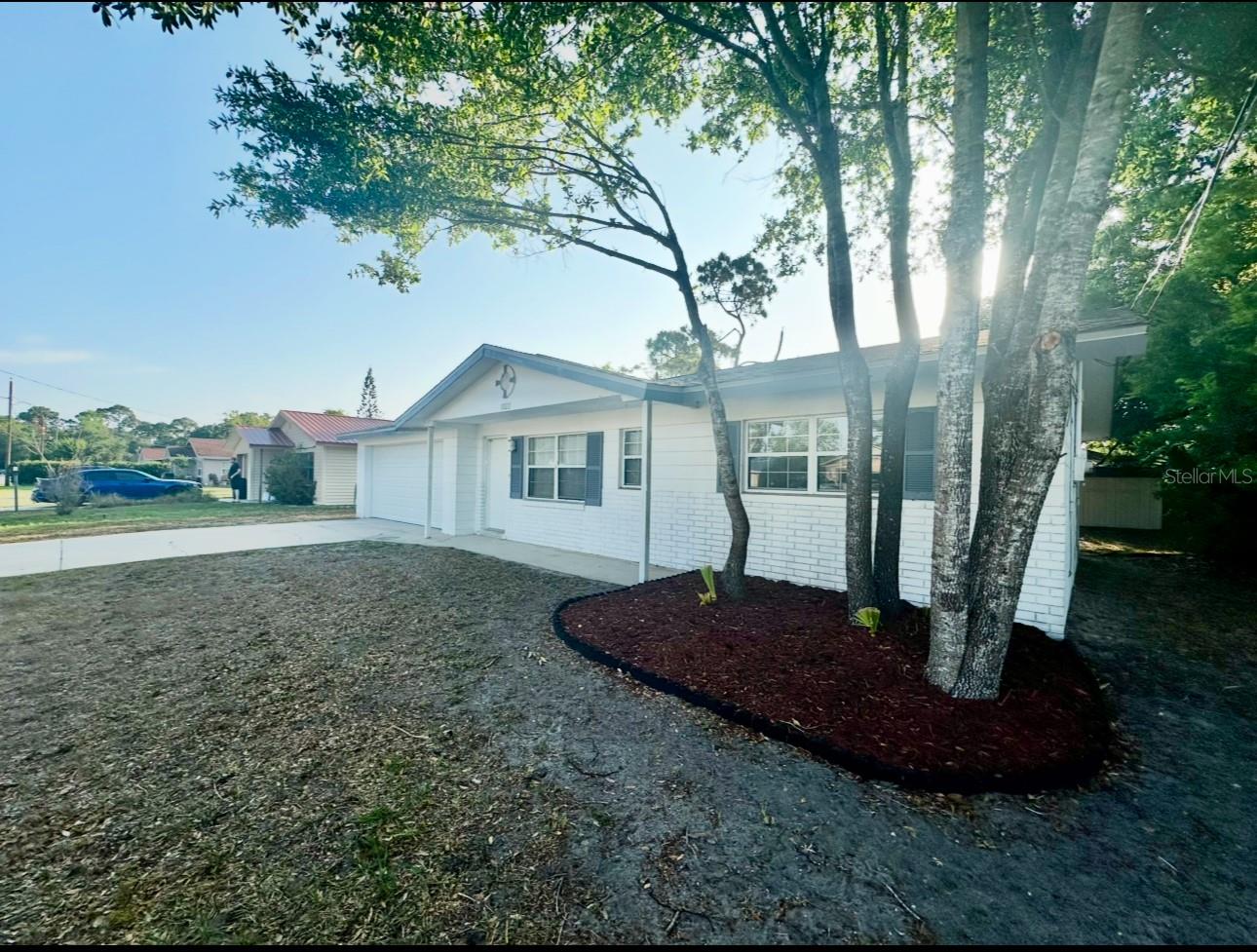 Great starter home with potential! Perfect for new homebuyers or investors. This 2-bedroom, 2-bath home with a large 2-car garage is in a prime Port Orange location near Dunlawton bridge. It features a (2022) roof , new garage door with an upgraded electric opening system (2024), and new PGT windows and slider installed 7/17/25. The large yard offers plenty of space for outdoor living, gardening, or future expansion. No flooding or damages from past hurricanes. Conveniently located near Sugar Mill Gardens, quick access to Ridgewood or Nova Road and just a few minutes from the beach. Enjoy easy access to children's parks, kayak launches, shopping, and dining. A fantastic opportunity for a move-in-ready home with great potential. Total bldg area 1918.