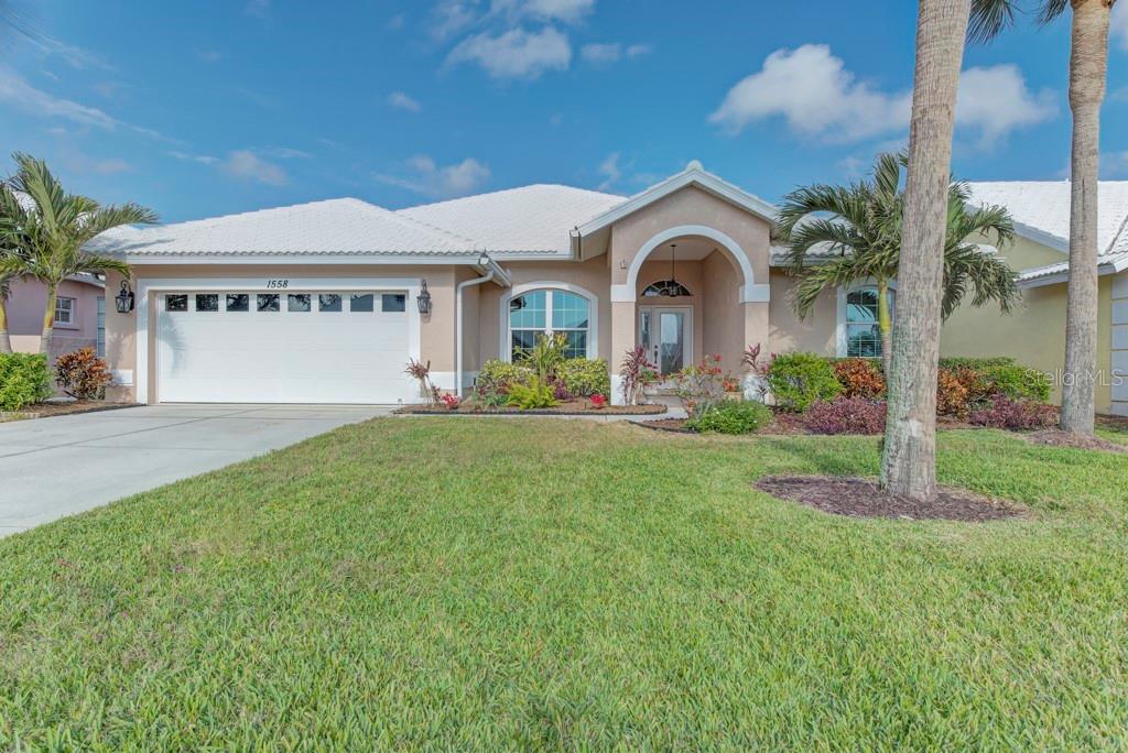 Stunning Lake and Golf Course View Home at Waterford Golf Club
Welcome to your dream home in the highly sought-after Waterford Golf Club community! This beautifully updated 3-bedroom, split-plan home offers breathtaking views of the lake and the meticulously maintained 18-hole golf course.
Step inside to discover an open-concept living and dining room combination, complemented by a spacious kitchen and family room perfect for entertaining. The home boasts soaring volume ceilings and an abundance of natural light throughout.
Recent updates include:
   •   Updated bathrooms with contemporary designs.
   •   New flooring and fresh paint inside and out, creating a polished, move-in-ready feel.
   •   New HVAC system and water heater for peace of mind.
   •   Upgraded, hurricane-rated windows and patio doors for safety and energy efficiency.
   •   Entire home re-piped with new waterlines.
   •   Roof installed in 2017.
The kitchen features custom wood cabinet doors, adding a unique touch of craftsmanship and character. However, the owner understands that some buyers may prefer a different look, so the buyer will have the opportunity to select their desired cabinet color to be professionally painted.
Enjoy resort-style living with access to Waterford Golf Club amenities, including the clubhouse, restaurant, tennis courts, pickleball courts, and more. The vibrant community offers an active lifestyle with picturesque views and a serene atmosphere.
Don’t miss your chance to own this exceptional property. Schedule your private tour today!