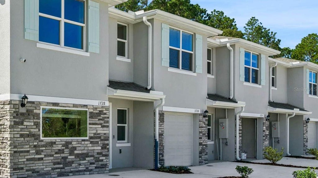 Photo of 1680 Sugarwood Loop, Deland, FL 32724 (MLS # O6453638)