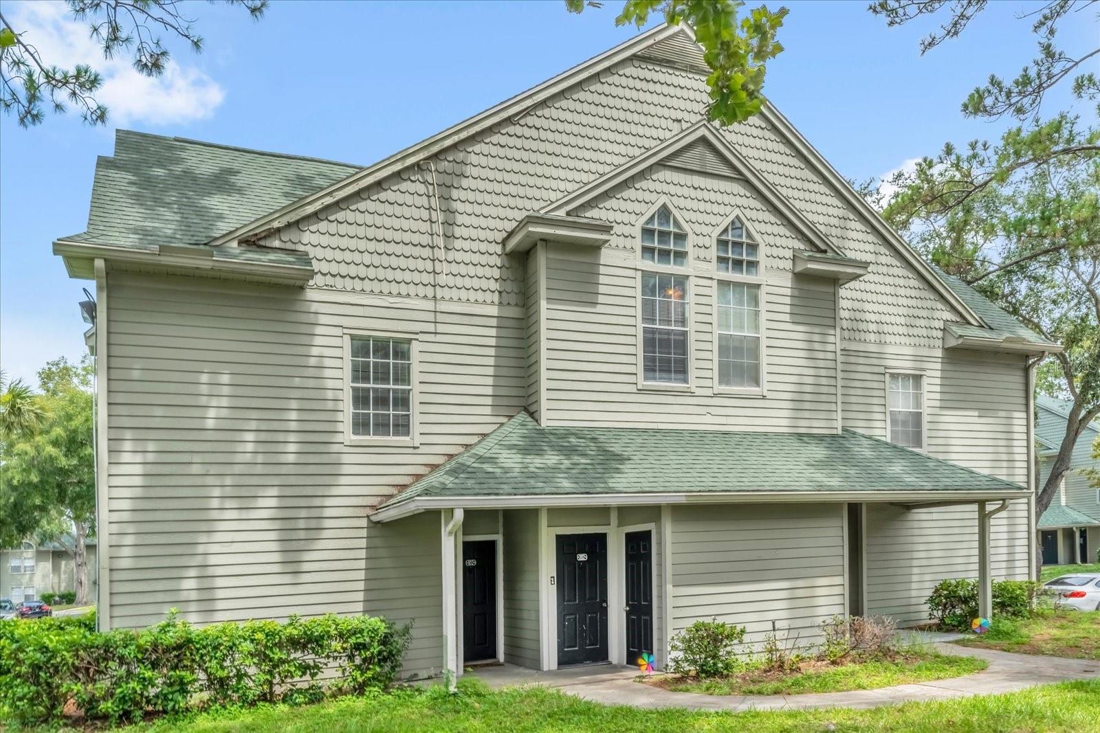 This well maintained unit features 2 bedrooms, 2 bathrooms, and a spacious loft, offering flexible space for a home office, gym, or guest area. The main living space is located on the second floor, along with both bedrooms, while the loft occupies the third floor. Enjoy an open floor plan that seamlessly connects the kitchen, dining, and living areas—ideal for everyday living and entertaining. The living room boasts vaulted ceilings, a wood burning fireplace, and abundant natural light. Additional highlights include fresh interior paint, durable laminate flooring, and a screened in porch with an attached storage closet. Located in a gated community offering amenities such as a swimming pool, jacuzzi, tennis and volleyball courts, fitness center, grilling station, playground, and car wash area. Conveniently located near the 408, the Mall at Millenia, theme parks, and the popular Dr. Phillips dining and shopping district off Sand Lake Road. This home offers both lifestyle and accessibility. Call today to schedule your private showing!