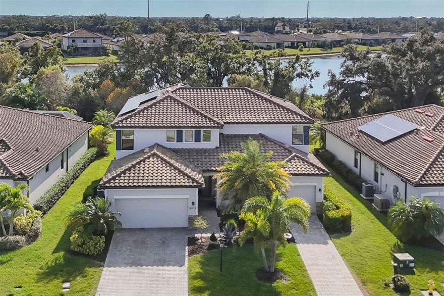 Welcome to this expansive and versatile over 3,900-square-foot residence in the highly desirable, solar-powered community of Polo Run. Thoughtfully designed for modern living, this six-bedroom, four-and-a-half-bath Lennar Next Gen® Liberation model offers a completely private multigeneration suite perfect for in-laws, college-aged children, or anyone seeking independence. As you approach the home, the paver driveway and lush tropical landscaping maintained by the HOA create a warm and welcoming first impression. Step inside to an inviting open-concept living area that seamlessly connects the formal dining room, great room and a bright eat-in kitchen. The kitchen boasts white cabinetry, a stylish shiplap island, granite countertops, stainless steel appliances and a spacious walk-in pantry. Sliding doors from the great room lead to the oversized, covered lanai, perfect for dining, entertaining, or simply enjoying peaceful preserve views with no neighbors in sight. Upstairs, a generous multipurpose loft anchors the second floor, surrounded by five bedrooms. The owner’s suite offers a relaxing retreat with a large walk-in closet and spa-like en-suite bath featuring dual sinks, a soaking tub and a walk-in shower. Four additional bedrooms provide endless flexibility for guest rooms, offices, fitness space or playrooms. The second floor also includes two full baths and a conveniently placed laundry room. A standout feature of this home is the Lennar Next Gen® model design, offering a completely private multigenerational suite with its own separate entrance, single garage, living room, kitchenette, bedroom, full bath, walk-in closet, washer and dryer, and sophisticated upgrades like crown molding, window molding, chair rail and wainscoting. Both the main home and the Next Gen® suite enjoy direct access to the lanai, where a large, covered area with built-in bar invites year-round outdoor living. Additional highlights include solar panels for energy efficiency, hurricane shutters, and a tankless water heater for added comfort and peace of mind. Residents of Polo Run enjoy a vibrant, maintenance-free lifestyle with resort-style amenities, including a clubhouse, resort pool, fitness center, bocce ball, tennis, pickleball and basketball courts. The community also features a dog park, playground and an active social calendar filled with classes, events and activities. With convenient proximity to shopping, dining, A-rated schools and quick access to I-75, this home offers the perfect blend of luxury, location and sustainability. Don’t miss your opportunity to live beautifully and independently in one of Lakewood Ranch’s premier communities!