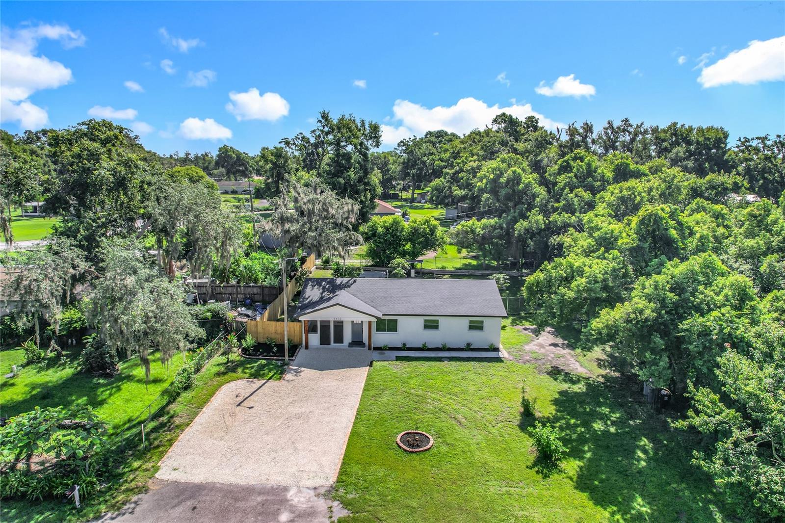 Absolutely stunning, fully remodeled 3-bedroom, 2-bath home with NO HOA, perfectly situated at the end of a quiet cul-de-sac! Enjoy ample parking for boats, RVs, trailers, or work vehicles. Step inside to find a gorgeous, brand-new kitchen featuring solid wood, dovetailed cabinets with soft-close doors and drawers, elegant gold hardware, quartz countertops, and new stainless steel appliances. The open floor plan seamlessly connects the kitchen, dining, family, and living areas, all enhanced by beautiful luxury vinyl tile flooring. A screened-in porch extends your living space for year-round enjoyment. The spacious master suite offers a walk-in shower for easy accessibility, and the inside laundry adds convenience. The oversized back patio is perfect for grilling and entertaining, while the fully fenced backyard provides plenty of space for pets, gardening, or simply relaxing in peace and tranquility—all on over ¼ acre. This home has been upgraded with all new windows, interior and exterior doors (2025), a new roof (March 2025), new HVAC (2025), and a new water filtration system (2025)—truly like buying a brand-new home! Don’t miss this move-in ready gem—come see it today!
