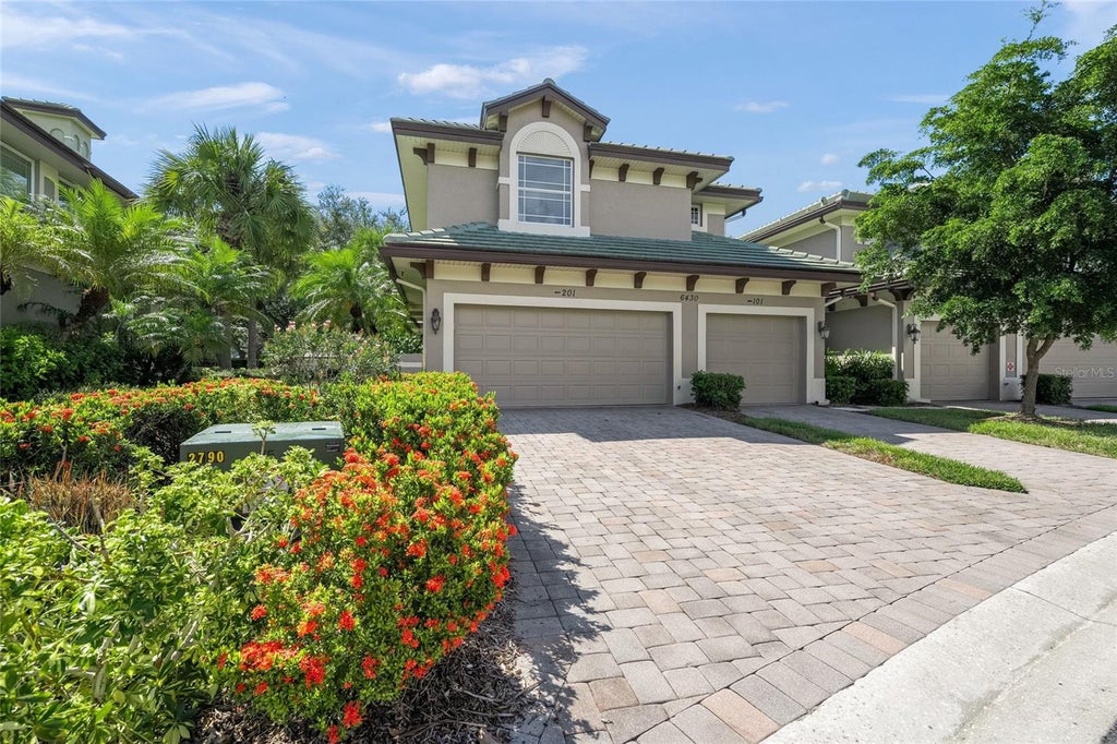Photo of 6430 Moorings Point Circle #201, Bradenton, FL 34202 (MLS # A4703597)