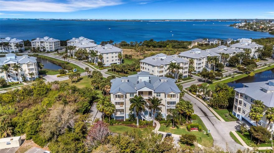 This second-floor condo in Palma Sola Bay Club offers a peaceful, private setting with preserve views and a subtle glimpse of Palma Sola Bay. The three bedroom, two and a half bath floor plan spans more than 1,800 square feet and includes two balconies, tile flooring throughout, and is being offered turnkey furnished. The open living and dining space provides plenty of room for everyday living or hosting guests, while the split bedroom layout offers privacy for owners and visitors alike. Additional conveniences include two reserved parking spaces under the building and a separate storage area. Palma Sola Bay Club is a Key West–style gated community just off the bay, known for its well-kept grounds and thoughtful amenities. Residents enjoy a pool, fitness center, clubhouse with billiards, sunset dock with kayak launch, lakeside walking paths, putting green, and dog park. Located in West Bradenton, the community is just a short drive to Anna Maria Island beaches, Robinson Preserve, De Soto National Memorial, and a variety of local shopping and dining. A well-positioned residence that pairs a private setting with the ease of condo living.