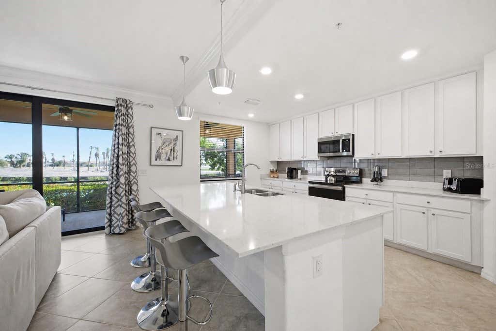 Photo of 10792 Tarflower Drive #102, Venice, FL 34293 (MLS # A4701064)