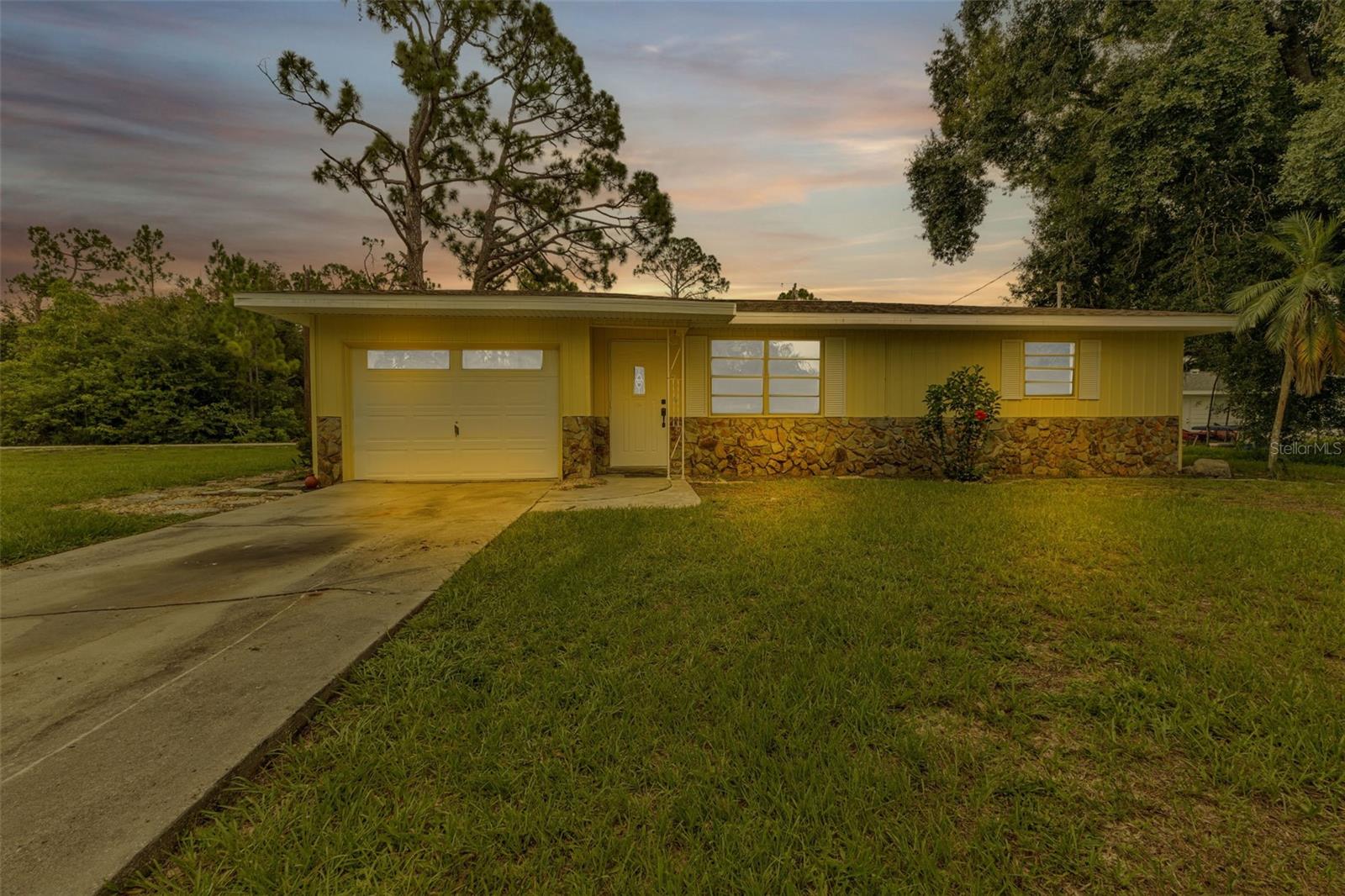 This freshly remodeled 2 bedroom 1 bath home is ready for its new owners. This home is situated on a fantastic pie shape corner lot that grants you plenty of space and privacy. Has extra living space from partially finished garage that could be used as a 3rd bedroom if desired. The home has undergone and extensive renovation with the following to note: New roof 2024, New AC. New blown in insulation throughout the entire attic. New paint interior and exterior. Full new kitchen including new appliances, wood cabinets and quartz counters. New Tile backsplash. New ceiling fans. New pluming fixtures throughout. Luxury vinyl plank throughout the main house and fresh new carpet in the bonus room and linoleum in the laundry. All new bathroom from tiled showers to the vanity. All new landscaping including 22 clusias plants that will grant tons of privacy when grown in. This would make for a fantastic first time residence or investment rental property. Schedule your private showing now.