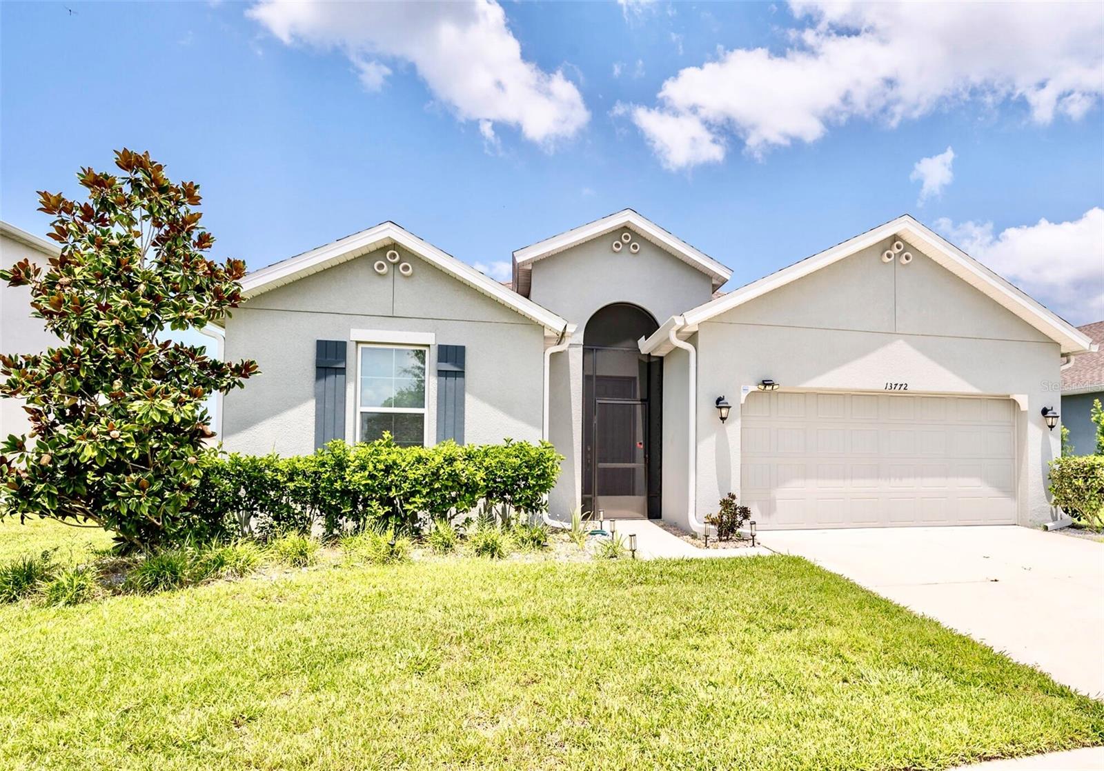 Florida living at its best! This beautifully maintained 4-bedroom, 2-bath lakefront home in the desirable Lakeside Phase 6 community features an oversized enclosed screen lanai with a brand-new heated / chiller saltwater pool surrounded by brick pavers, covered porch, fire pit area, and a completely fenced-in yard with lush landscaping and gorgeous grass. The outdoor living space is a true highlight, with a spacious lanai, lake view, ceiling fans, and privacy curtains that let you enjoy the Florida lifestyle year-round—ideal for entertaining guests or relaxing with family in comfort. Built in 2022, the homeowner has spared no expense enhancing this home with a front screened entry, owned water softener, gutters, added lights and ceiling fans, a beautiful kitchen backsplash, and multiple custom shelving units in several rooms and the garage. Inside features commercial-grade vinyl plank flooring throughout, an open kitchen with stainless steel appliances, quartz counter tops ,large island, and a split-bedroom layout with a spacious primary suite. Just 4 miles from Sam’s Beach Bar and several popular Gulf Coast restaurants and bars. Lakeside is a resort-style community with a clubhouse offering activities and classes like pickleball, tennis, and book clubs, plus private event space, pool parties, holiday celebrations, and golf cart events for the entire family, along with a pool, fitness center, playground, soccer fields, walking trails, fishing pier, and lake access for canoes, kayaks, and small watercraft. Low HOA and CDD fees make this move-in ready home an exceptional value. Book your tour soon, this home will not be available for long!!!!!