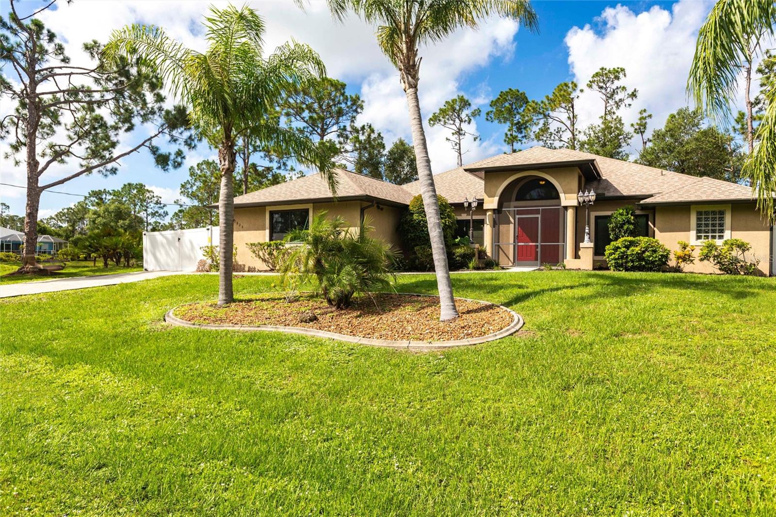 Step into this beautifully remodeled 3-bedroom, 2-bath home where modern upgrades and thoughtful design create a move-in-ready retreat with NO HOA and canal views. As you enter, you're welcomed by an abundance of natural light streaming through newly installed impact-resistant front windows—offering both enhanced security and energy efficiency while setting a bright, inviting tone throughout the home. Just off the main living area, new luxury vinyl plank flooring guide you into the spacious kitchen, fully updated in September 2024 with gleaming granite countertops that continue up the backsplash, and brand-new stainless steel appliances. The open layout flows effortlessly into a cozy dining area and adjacent bonus room, featuring soundproof windows—perfect for a quiet office, playroom, or media space. Tucked away at the back of the home, the primary suite offers a newly renovated bathroom with an updated shower and relaxing soaking tub. Two additional bedrooms and a second full bath provide space for guests. A brand-new washer and dryer stay with the home, conveniently located near the main hallway. Step outside to a screened lanai overlooking the peaceful canal, and fully fenced yard, where you can enjoy kayaking or just take in the view. Additional upgrades include a 2023 roof and A/C, updated soffit and fascia, and a WHOLE-HOUSE GENERATOR already hooked up in the garage for peace of mind. Located in a quiet area of North Port, you’re just minutes from Wellen Park, CoolToday Park, Warm Mineral Springs, nature preserves, and a growing collection of shops, restaurants, and parks—all with easy access to I-75, area beaches, and top-rated schools. This is Florida living done right—updated, secure, and surrounded by everything you love.