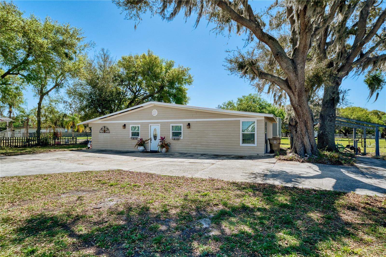 Price Reduction!!!! INVESTOR Opportunity! Two homes on a full 1-acre corner lot. VALUE IS IN THE LAND AND INCOME POTENTIAL. Cash or Private Money only. Located just off Boggy Creek in the sought-after Lake Nona area—minutes from Lake Nona, Medical City, and the Airport. No HOA, No CDD—live in one home and rent the other, rent them both, or tear them down and build your dream home! Currently on septic and well, but public utilities are nearby. The property is cross-listed as real property MLS#O6284877 and land MLS#O6289735, offering excellent development potential. Surrounded by both new construction and rural preserve. Zoned for horses—check with the county/zoning for permitted uses.