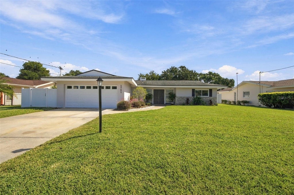 Photo of 1721 Harbor Circle W, Largo, FL 33770 (MLS # TB8561961)