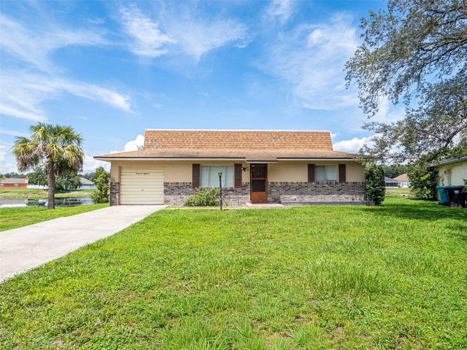 Welcome to your cozy 2 bedroooms move-in ready home in the heart of Orlando! Tucked away in a quiet, peaceful neighborhood, this home is perfect as a starter home, downsizing, or investors seeking a move-in-ready rental property. Step inside to a freshly painted interior with a bright open floor plan ready for your personal touch, newer carpet in the bedrooms, and updated bathrooms. Relax in the enclosed screen porch with peaceful water views, enjoy the privacy of an end-unit with a large side yard, plus an extended one-car garage with a large front yard. This home offers an easy commute to downtown Orlando, Rosemont, and Altamonte Springs, with plenty of shopping, restaurants, and amenities nearby. This home is a gem, schedule your showing today!