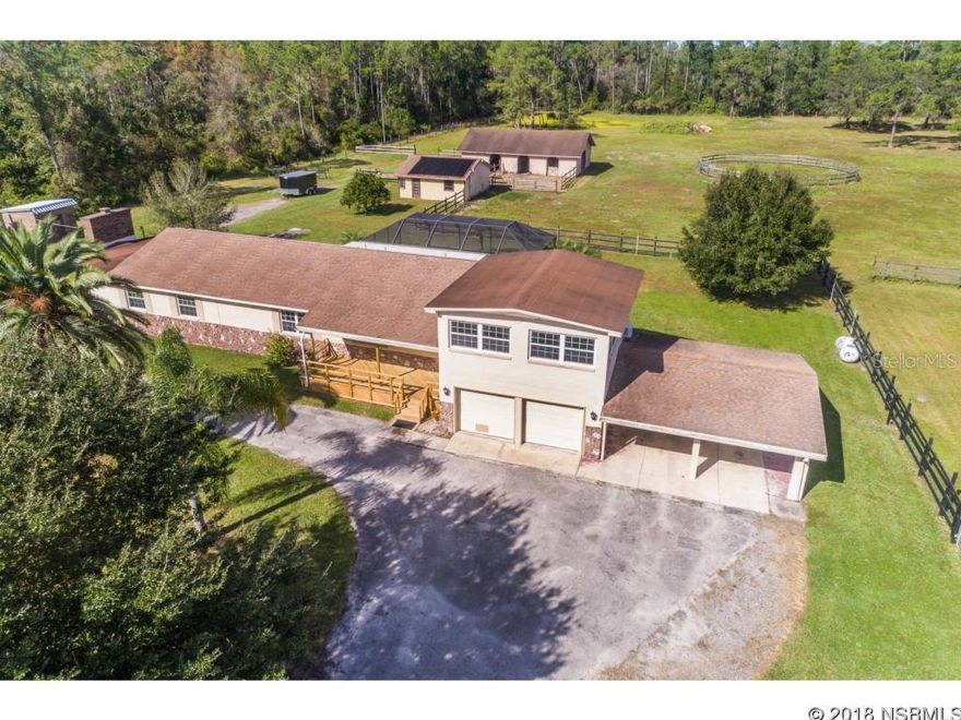 TAKING BACK UP OFFERS! COUNTRY HOME on 7.5 Acres! This Concrete block 4 Bedroom, 3 Bath home includes an Apartment/Studio with bath over the 2 Car Garage. Saltwater, Solar Heated Pool, 34x50 Four Stall Barn with 3 Tack/Hay Rooms, swing out feeders, electric/water, Round Pen 57' Across. 23x25 Workshop with Power (220amp) and 9ft Garage door, Electric Fence around 5 acres, adjacent 2.5 acres mostly wooded. Pond in rear of the 5 acres. NEWER Kitchen w/ Granite Countertops & Soft Close Cabinets, NEW Waterproof Vinyl Flooring in Kitchen, Dining, Entry & Hall. Wood burning Fireplace, Fresh Paint, Whole House Generator with outside propane tank. Updated Electric & New A/C 2014. Water Heater 2016, Well 2018. Minutes from New Smyrna shopping & beaches, Port Orange, & the Sanford/Orlando area! More Pics Coming! Lifetime transferable warranty on the windows and transferable termite bond.
