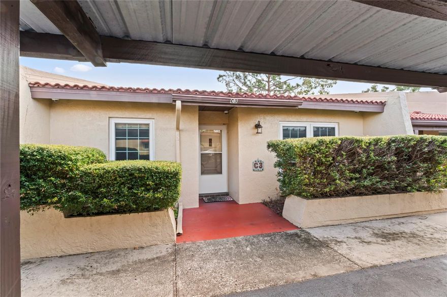 Drive into the quiet, peaceful grounds of The Villa Nueva Community  – a private and well maintained community of only 53 one-story and two-story condos that feature  clay barreled tile roofs and appreciate the quaint, storybook community.  This Largo Villa does needs some updating.     This villa is not located in a Flood Zone! This  2 bedroom, 2 bath Villa, is near the community pool and clubhouse.  The kitchen features a newer stainless steel stove and large wall pantry with several shelves. The villa floors are interestingly stained concrete for easy maintenance and cleaning. For maximum privacy, the primary bedroom is on the west side that features an adjacent bathroom with tub & shower .  The east side bedroom is split from the primary bedroom.  The 2nd bedroom has the closet with a stackable newer Washer/Dryer and the new water heater. The back patio continues this open concept to provide a light bright atmosphere as it looks out on to the back yard so you can sit and enjoy all types of Florida weather. Carport in front of the Villa and storage unit on the other side. HVAC was replaced in  June 2025 and ductwork in replaced in 2020.   Impact Windows installed (2021). The HOA fee includes Cable, Internet, Water, Sewer, Trash, Exterior Maintenance (Roof), Lawn Maintenance, Pest Control, and access to the community POOL & clubhouse! Centrally Located 10-20 minutes to Clearwater Beach with all its entertainment & restaurants, 10 minutes to St. Pete Airport and 20 minutes to Tampa. Seller will look at highest and best offers.