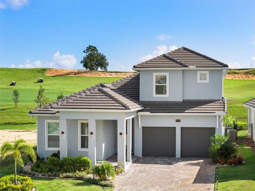 Overlooking the 13th fairway, this refined golf-front estate blends timeless architecture with modern sophistication. Designer finishes, thoughtful detailing, and expansive golf course views set the tone for elevated living throughout.

The well-designed floor plan offers a seamless balance of open gathering spaces and private retreats. The main level features the primary suite with a dramatically expanded walk-in closet, creating a true boutique-style dressing experience. Two additional bedrooms are also located downstairs and share a beautifully appointed hallway bath with custom finishes. Upstairs, an expansive bonus room with wet bar serves as a versatile lounge or entertainment space, flanked by two additional bedroom suites with ensuite baths and walk-in closets, ensuring comfort and privacy for family and guests.

At the heart of the home, the kitchen pairs beauty with performance with premium appliances, custom cabinetry, and an oversized island that anchors the living spaces. Seamlessly connected to the kitchen, the great room is highlighted by a sleek vapor fireplace, adding a contemporary focal point ideal for both everyday living and elegant entertaining.

Outdoor living is equally impressive. The covered lanai is designed for year-round enjoyment with retractable screens, summer kitchen, resort-style pool, and spa — all positioned to capture uninterrupted views of the 13th fairway. Whether entertaining at sunset or enjoying a quiet morning overlooking the course, the setting is exceptional.

Additional features include a transferable lease for the home’s solar panels, offering energy efficiency without sacrifice. The home is being sold furnished, with select exclusions in addition to personal items and artwork. Televisions do not convey. A golf cart is included, allowing seamless enjoyment of the community lifestyle from day one.

This is a must-see property that truly must be experienced in person to appreciate the level of finish, scale, and golf-front setting.

Located within the guard-gated community of Bella Collina, residents enjoy access to world-class amenities including a championship golf course, resort-style pool, full-service spa, Har-Tru tennis courts, pickleball, fitness center, multiple dining venues, and a full calendar of social events — all just minutes from downtown Winter Garden, area attractions, and the best of Central Florida. Developer will defer the $40,000.00 Sports Membership deposit.