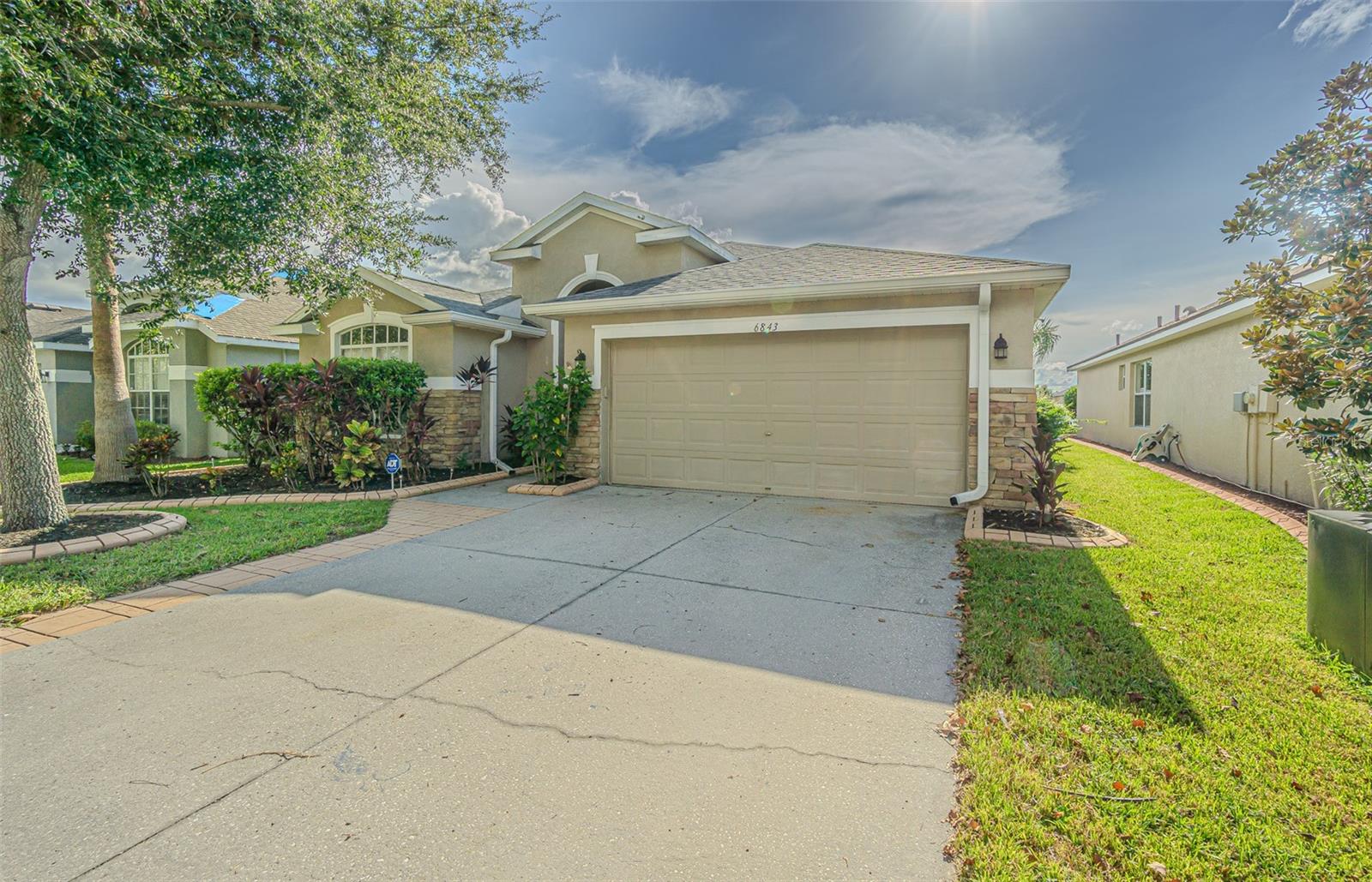 SOLAR SAVINGS + ASSUMABLE FHA MORTGAGE at 3.99%!
Enjoy instant equity and long-term savings with this energy-efficient home featuring PAID-IN-FULL solar panels installed on a newer roof (2023). Take advantage of the assumable FHA mortgage at just 3.99%—a rare opportunity to lower your monthly payments and save thousands annually.
Nestled on a fully fenced, pond-view lot in the sought-after Oak Creek community of Wesley Chapel, this Inland-built home offers over 2,000 square feet of well-designed living space. The smart 3-way split floor plan provides privacy for all, featuring 4 bedrooms, 2 full bathrooms, and a combination of both open-concept and formal living areas. The spacious kitchen features 42-inch cabinets with crown molding, granite countertops, stainless steel appliances, and a breakfast bar, making it both stylish and functional. Triple sliding glass doors from the family room and additional sliders from the dinette open to a covered patio with peaceful pond views, creating a seamless connection to the outdoors. The primary suite offers a walk-in closet, dual sinks, a soaking tub, and a separate shower for a relaxing retreat. Fresh interior paint and new carpet in the secondary bedrooms complement the beautiful bamboo flooring that flows throughout the main living areas and primary bedroom. Curb appeal is enhanced by decorative landscape curbing, adding charm and character to the home's exterior.
Highlights include:
• Energy-saving solar panels (2019) Paid In Full
• Architectural shingle roof (2023)
• A/C replaced in 2019
• Assumable FHA mortgage at 3.99%
The Oak Creek community offers impressive amenities including a resort-style pool, dog park, picnic pavilions, covered playground, basketball/pickleball court, and scenic walking trails. Don’t miss this rare blend of efficiency, location, and value—schedule your private showing today!