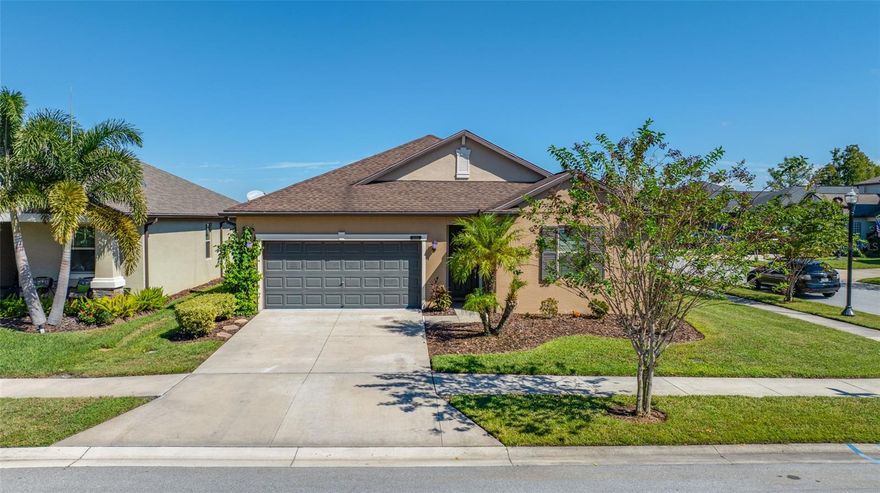 Welcome to your dream home in the heart of Land O' Lakes! This beautifully updated 4-bedroom, 3-bath home sits on a spacious corner lot with lush, low-maintenance landscaping—including mature palms that add a touch of tropical charm. Freshly painted and move-in ready, this home features stylish new barnwood-look flooring in the bedrooms and a thoughtfully designed triple-split floorplan for maximum comfort and privacy. The spacious primary suite overlooks the peaceful backyard and boasts a luxurious 13-ft deep walk-in closet, plus a private en suite bath with dual vanities, a relaxing soaking tub, and a separate walk-in shower. Two generously sized bedrooms are located at the front of the home, with a fourth bedroom just off the kitchen—perfect for guests or a home office. At the heart of the home is the open-concept kitchen and living space, complete with granite countertops, tile flooring, a large pantry, and abundant cabinet space. The combined living and dining area offers plenty of room for entertaining, and ceiling fans are installed in all bedrooms and the living room for year-round comfort. You’ll also appreciate the convenient dual access laundry room—easily reached from both the kitchen and primary bedroom. Step outside to your own private backyard oasis, featuring a large screened-in lanai, a spacious patio area perfect for outdoor seating or grilling, and a fully fenced-in yard—ideal for relaxing, entertaining, or letting pets play safely. For added peace of mind, the home includes a fully automated whole house natural gas generator, so you're always prepared. Located in the sought-after master-planned community of Connerton, you’ll enjoy access to world-class amenities including a resort-style pool with water features, a lap pool, fitness centers, playgrounds, walking and biking trails, basketball and tennis courts, a fishing pier, and even a bike park. This golf cart-friendly community is designed for connection, recreation, and convenience—with future plans for a vibrant town center and four distinct villages surrounded by 1,800 acres of parks and protected natural areas. Don’t miss the opportunity to live in one of the most desirable communities in Land O’ Lakes. Schedule your private tour today!