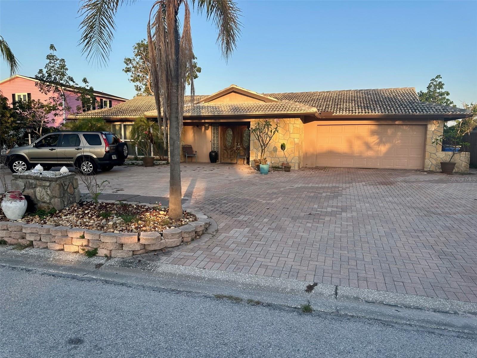 Great Waterfront living in Rocky Point Tampa neighborhood. Land ownership includes to middle of canal. Salt water canal leads to open waters. Plenty of room for boat lifts and dock. Block home needs work. Large inground pool. There is a greenhouse in the back. Water intrusion during hurricane Helene was repaired. Sellers have never lived in the house. Sold As-Is with right to inspect.