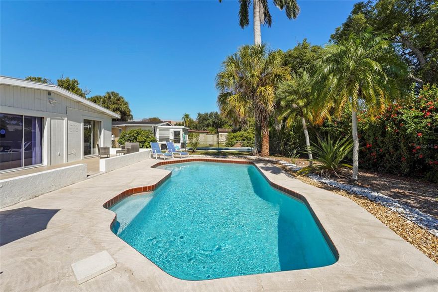 Welcome to 5619 New York Avenue, a charming Sarasota retreat where comfort, style, and convenience come together beautifully. Nestled in a quiet neighborhood with no HOA, this home offers the freedom to truly make it your own while being just minutes from Siesta Key Beach, Downtown Sarasota, and all the coastal lifestyle has to offer.

As you arrive, refreshed tropical landscaping and a welcoming curb appeal set the tone. Step inside to find a bright, open layout designed for easy living and connection. Natural light fills every corner, reflecting off tile floors that create a clean and calming atmosphere. The kitchen opens to the living space, perfect for entertaining or relaxed family gatherings, while large sliding doors invite you to step outside and experience the home’s centerpiece, your private backyard oasis.

Out back, the sparkling pool is surrounded by lush greenery, offering a peaceful escape where you can unwind, host weekend barbecues, or simply soak up the Florida sun. The fenced yard provides privacy and room for pets or gardening, creating a perfect blend of relaxation and functionality.

Whether you are looking for a full time residence, a seasonal getaway, or an investment opportunity, this home captures what makes Sarasota living so desirable. You are close to the area’s top beaches, shopping, dining, and cultural attractions, yet tucked away in a neighborhood that feels like your own personal retreat.

This is your chance to own a pool home in Sarasota that combines character, comfort, and location while giving you the freedom of no HOA restrictions. Experience the lifestyle you have been dreaming of at 5619 New York Avenue.