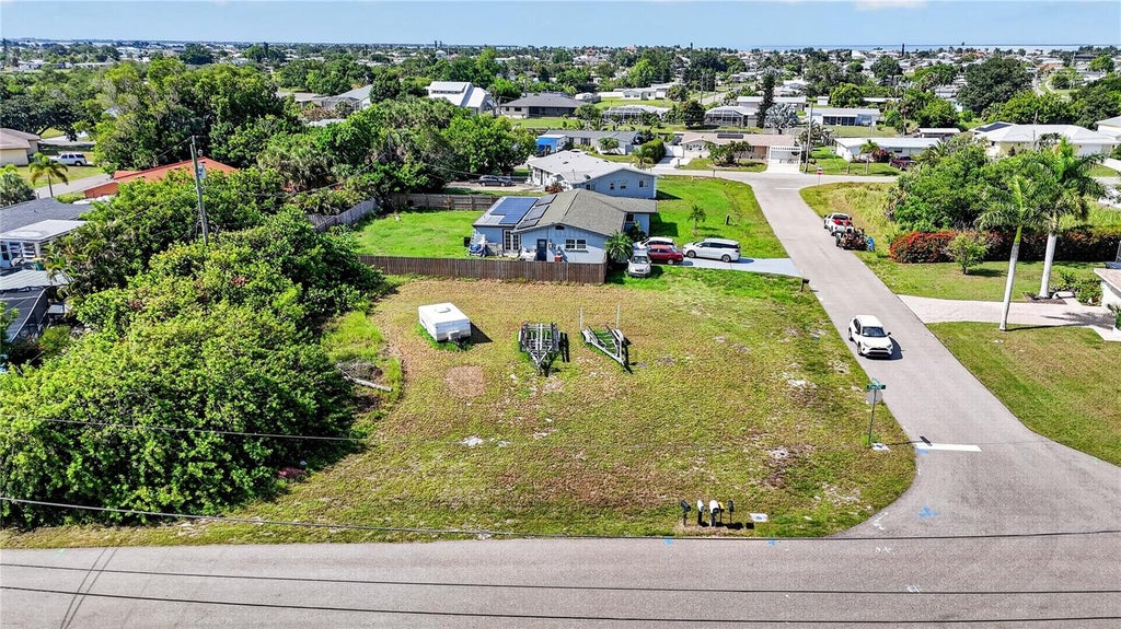 Photo of 153 Sherman Avenue NE, Port Charlotte, FL 33952 (MLS # O6453951)