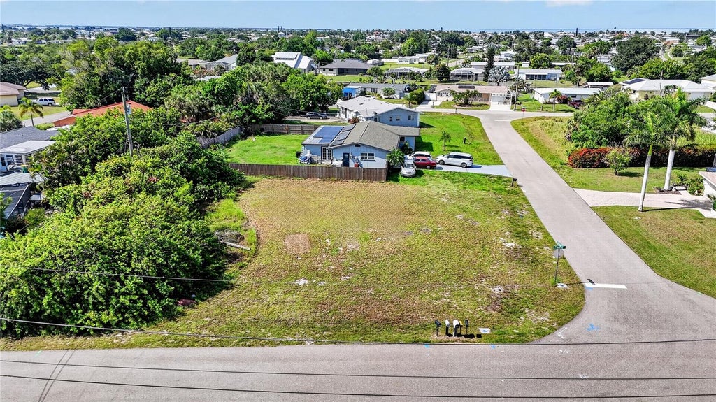 Photo of 153 Sherman Avenue NE, Port Charlotte, FL 33952 (MLS # O6453951)