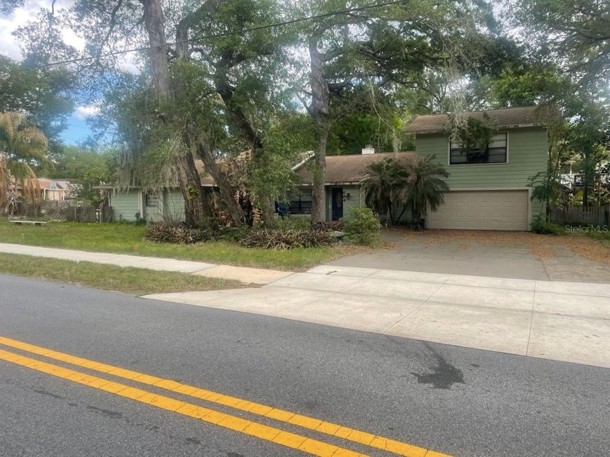 Spacious pool home in DeLand Country Club Estates offering nearly 2,900 sq ft on a large corner lot. This 3 bedroom, 3 bathroom home features a flexible layout with two primary suites, including one downstairs, multiple living areas, and a wood-burning fireplace. Additional office/bonus space offers potential to convert into a 4th bedroom with closet addition. The home needs some TLC but has strong potential for buyers looking to update and make it their own. The backyard includes a private pool and large patio space with plenty of room for outdoor living. Conveniently located near historic Downtown DeLand, shopping, dining, Stetson University, and easy access to Orlando and Daytona Beach. Sold as-is