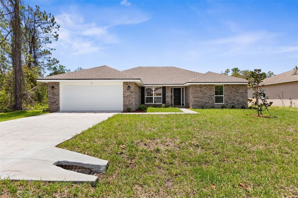 Photo of 67 Royal Oak Drive, Palm Coast, FL 32164 (MLS # FC313520)