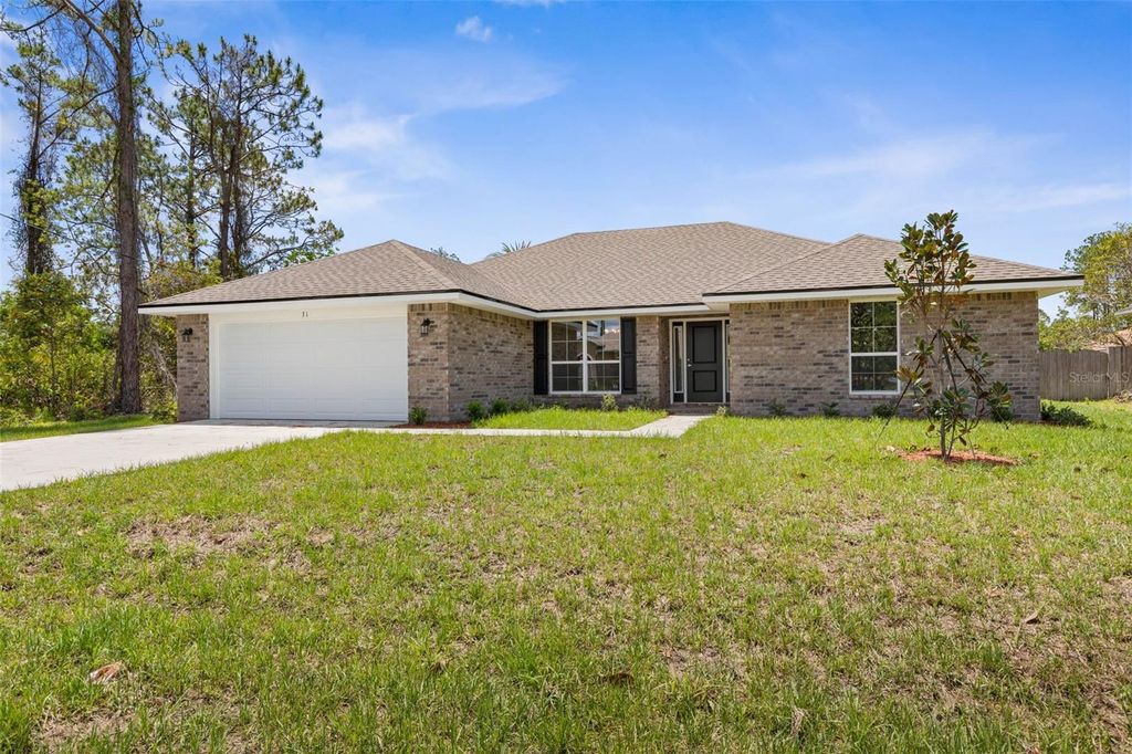 Photo of 67 Royal Oak Drive, Palm Coast, FL 32164 (MLS # FC313520)