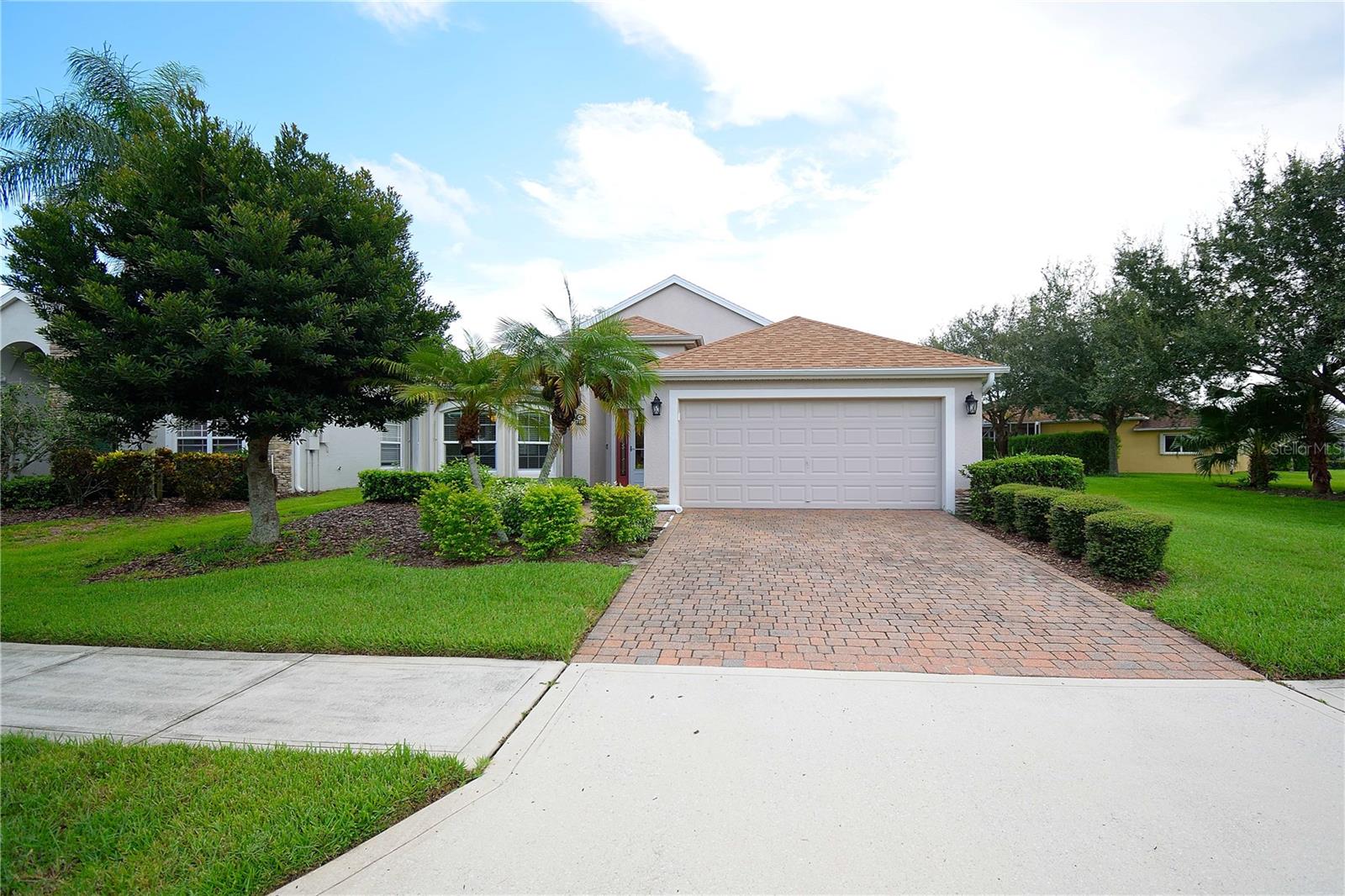 Discover West Viera's premiere 55+ gated community, HERITAGE ISLE. This home is move-in ready with a bright & open floor plan. The spacious kitchen offers bay windows, eat in kitchen, ample counter space, and large pantry. It has matching granite counters in the kitchen and both bathrooms along with new carpet in all three bedrooms. A newer roof 2018, A/C 2022, hot water heater 2023, and an epoxy garage floor. Master bathroom features large walk-in shower with double sink vanities. 2nd bathroom features single sink vanity, full bathroom with tub. It has accordion hurricane shutters along with several impact windows, You will have peace of mind knowing that the original owners have a home warranty that extends through February 2026 and will transfer at no cost to the new owners. It is on a premium 74' lot with beautiful landscaping. This community offers exterior maintenance of the house (painting every 7 years) & lawn service. The 21,000 sq. ft. clubhouse (the largest in Brevard County) offers something for everyone. From outside activities including tennis, bocce, shuffleboard, pickleball to state-of-the art workout facility, to inside activities including exercise classes, yoga, line dancing, card games, bingo etc. You can have drinks, lunch or dinner at the Isle Bar & Grill. Living in Heritage Isle is a senior's dream come true.