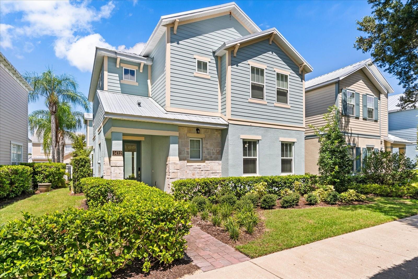 Stunning Key West Style Home that Blends Modern Luxury with Resort-Style Living! This like NEW 2022 build was designed with exceptional attention to detail. Featuring a fantastic open-concept floor plan, this home is loaded with high-end fixtures and energy-efficient LED lighting throughout. Step into the spacious living area, complete with a decorative electric fireplace and a built-in workspace as an added bonus, perfect for working remotely. The gourmet island kitchen is a chef’s dream, boasting ample cabinet space, quartz countertops, stainless steel appliances, and an additional wet bar sink. The dining area is adjacent to the kitchen and comfortably seats up to 10 guests, making it ideal for family gatherings or dinner parties. The first floor also includes an en suite bedroom with walk-in shower. Additionally there is a half bath adjacent to the dining area that also allows access to the pool area for guests. The garage has been transformed into a fun game room featuring a Pop-A-Shot basketball and other fun games, but can easily be converted back to a traditional garage if desired. Upstairs, you enter double doors to the luxurious primary suite, highlighted by tray ceilings and a spa-inspired bathroom with dual vanities and an expansive dual walk-in shower. The three remaining guest rooms are professionally decorated with theming also feature en-suite bathrooms. A versatile loft space has been converted into a cozy theater room, complete with a projector large screen and elevated seating perfect for movie nights. The laundry room is conveniently located on the second floor and has built-in cabinets as well. Start your mornings off right on the upstairs balcony, overlooking the incredible pool area below. The outdoor living space offers two covered lanais, perfect for summer BBQs and year-round entertaining. This home is an amazing opportunity for your rental investment property, second home or primary residence. Reunion Resort is a 2,300 acre Private Golf and Tennis Community, just 6 miles to Disney and the parks, and a 30 min drive to the Orlando International Airport. Enjoy the Reunion Grande where there are several delicious dining experiences that include a Sushi Bar, The 7593 Chophouse both located on the Lobby Level. Eleven is a rooftop restaurant & bar to enjoy your favorite cocktail, tapas style cuisine or relax by the fireplace and pool. Located adjacent to the hotel, enjoy the Golf Clubhouse, the Seven Eagles Pool Pavilion & fitness center. Additional amenities include 3 Signature Golf Courses, a miniature putt putt course, 5 Acre Waterpark, 12 community pools, playground, sand volleyball, tennis & pickleball courts and dog parks.