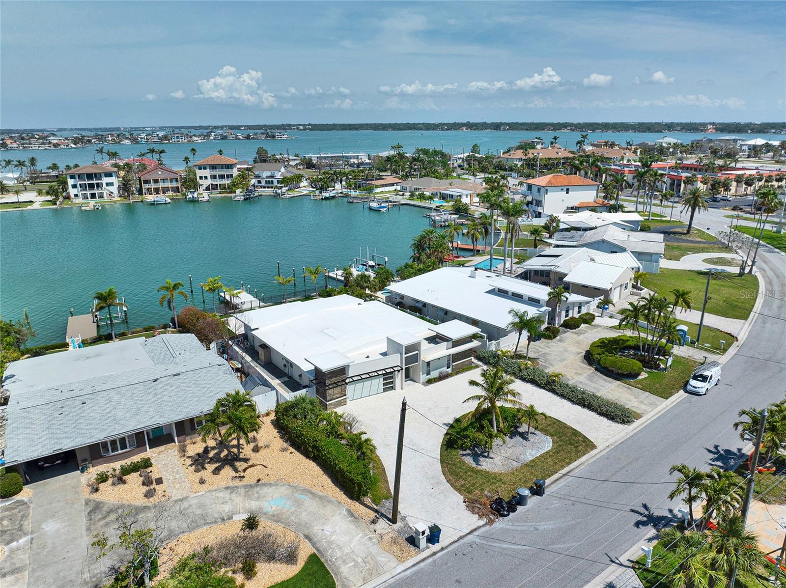 Opportunity of a lifetime to renovate an incredible waterfront home affected by hurricane Helene just one mile from the beach! This unique luxury home was a beautiful family beach house where many memories were made. The home features 2 master suites with 2 additional bedrooms, 3.5 bathrooms, and 2 car garage. The backyard is intact and still like a dream featuring low maintenance, artificial turf, a salt water pool with swim-up bar, breathtaking sunset views and a new, large dock for boating and fishing. Whether it’s sipping your coffee in the morning or a cocktail in the evening you are bound to see dolphin or even a family of manatees; truly a kid’s playground! The seawall was recently raised and reinforced in 2021. This home offers the very best of luxury living on Florida's Gulf Coast, whether you are hosting a great party or spending time with family and friends, this home is sure to impress! Do not wait to schedule your showing today as this slice of heaven will not be available for long.