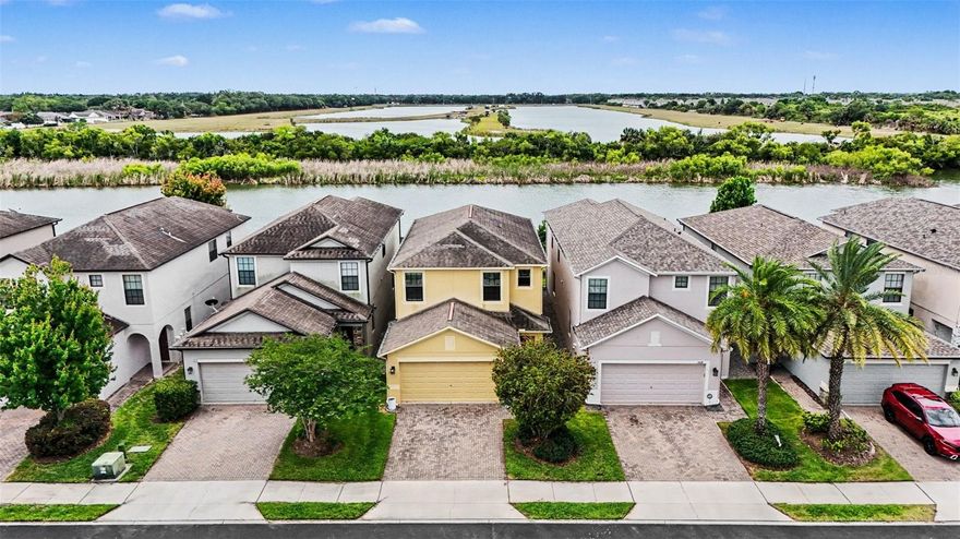 Welcome to 1606 Acadia Harbor Place! Located in the sought-after gated community of Brandon Pointe, this beautifully maintained home offers a stunning 180-degree panoramic pond view, creating a peaceful backdrop you’ll enjoy every single day. Residents enjoy access to a community pool, along with the added benefits of a low HOA, no CDD, and no flood insurance required, a rare find in today’s market. Plus, there are dozens of guest parking spots available throughout the community, making it easy to host friends and family. Inside, you’ll find newer luxury vinyl plank (LVP) flooring paired with a freshly painted interior (April 2026), giving the home a clean, modern feel that’s truly move-in ready. The kitchen is designed for both style and function, featuring granite countertops, stainless steel appliances, recessed lighting, and a walk-in pantry. It flows seamlessly into the main living area, all overlooking the water. Upstairs, you’ll find four bedrooms and a versatile loft, offering plenty of space for family, guests, or a home office. The primary suite features both a walk-in closet and a large reach-in closet, along with a spacious en suite bathroom complete with dual vanities, a soaking tub, and a separate shower. Major updates provide added confidence, including an HVAC system replaced in 2023 and a roof with approximately 10 years of remaining useful life. For even greater peace of mind, the home has been pre-inspected and successfully passed a four-point inspection, an advantage for buyers. Additional highlights include a paver driveway, a covered and screened lanai, and a low-maintenance exterior, making it easy to enjoy Florida living year-round. Ideally located just minutes from I-75, US Hwy 301, the Selmon Expressway, and Brandon Mall, and just a short stroll from Costco and other major retailers, this home offers unmatched convenience in a prime location. Whether you’re relaxing with your morning coffee overlooking the water or entertaining in a beautifully updated space, this home checks all the boxes. Don’t miss your opportunity to own a property that perfectly blends scenic views, thoughtful upgrades, and everyday convenience.