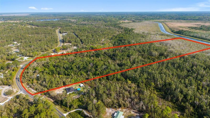 Welcome to your private escape nestled in the heart of Ocklawaha! Situated on a diverse and tranquil 39.31 acres, this property offers a rural setting with over 600' of newly paved road frontage and over 700' of Ocklawaha River frontage, with legal access. Whether you're looking for a peaceful homestead, a weekend getaway, or a place to build your dream lifestyle, 475 Fisher Rd delivers. It's close proximity to the Ocala National Forest as well as being only minutes away from Lake Weir, and all the modern amenities The Villages offers makes this property ideal for any number of possibilities. The property does include a nearly 1,800 SF manufactured home which would need extensive renovations, however also comes equipped with a septic system and well ready to go. Running thru the property is a charming little creek, fed by Bear Lake located directly across the street. Enjoy the freedom of having plenty of space surrounded by nature for exploring, adventure, and expansion. No HOA, zoned A1,  all opportunity. Bring your vision and make 475 Fisher Rd your next great investment or forever home.
