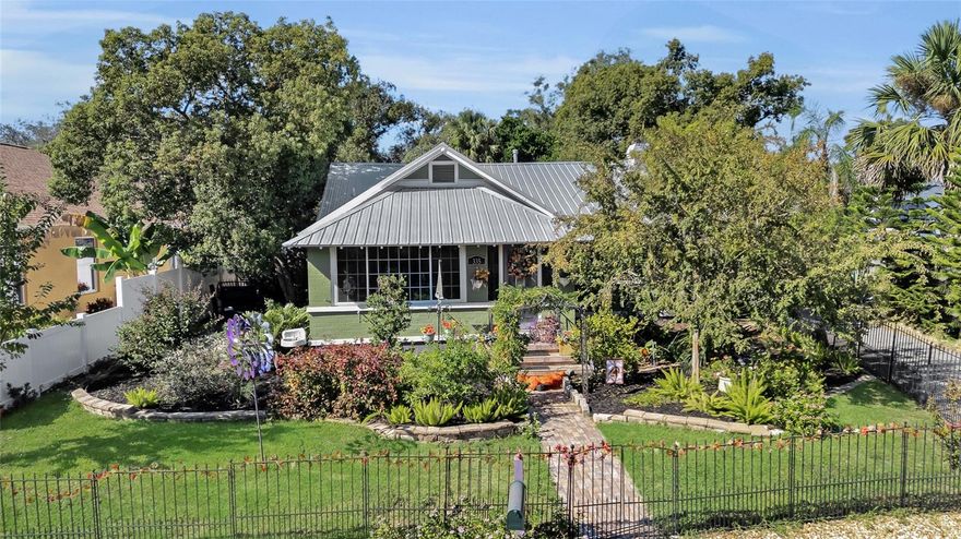 Enchanting Bungalow with Detached Potential Guest House. Located just Blocks from Downtown Mount Dora! Tucked away at 335 North Simpson, this stunning property offers the classic charm, character, and quality care you've always wanted, all in the highly desirable heart of Mount Dora. Step into the inviting atmosphere of this cottage-style home. The enclosed front porch leads directly into a spacious living room, featuring beautiful original wood floors, just refinished and stained as well as a cozy fireplace, setting the stage for comfortable living. The kitchen has been completely remodeled, showcasing a sleek, contemporary design and premium appliances, including a stainless steel, double-drawer under-counter refrigerator. Exceptional Care & Efficiency Updates are 2023 METAL Roof, 2020 Triple pane windows, 2024 Gas Hot Water Heater, 2015 Mini-Split AC Systems, Electric 2023.  Versatile Detached Potential Guest House (512 Sq Ft.) A fantastic bonus comes in the form of a completely renovated, separate 500-square-foot detached structure. This flexible space is perfect for a private guest house, a creative studio, or an income-generating Airbnb opportunity—your home, your choice! Pre-plumbing is already in place for the future addition of a kitchen and/or bath, maximizing its potential. The property includes an oversized, detached 1-car garage, which conveniently houses a full-size refrigerator and the washer and dryer. Historic soul meets modern peace of mind, all just a heartbeat away from downtown.