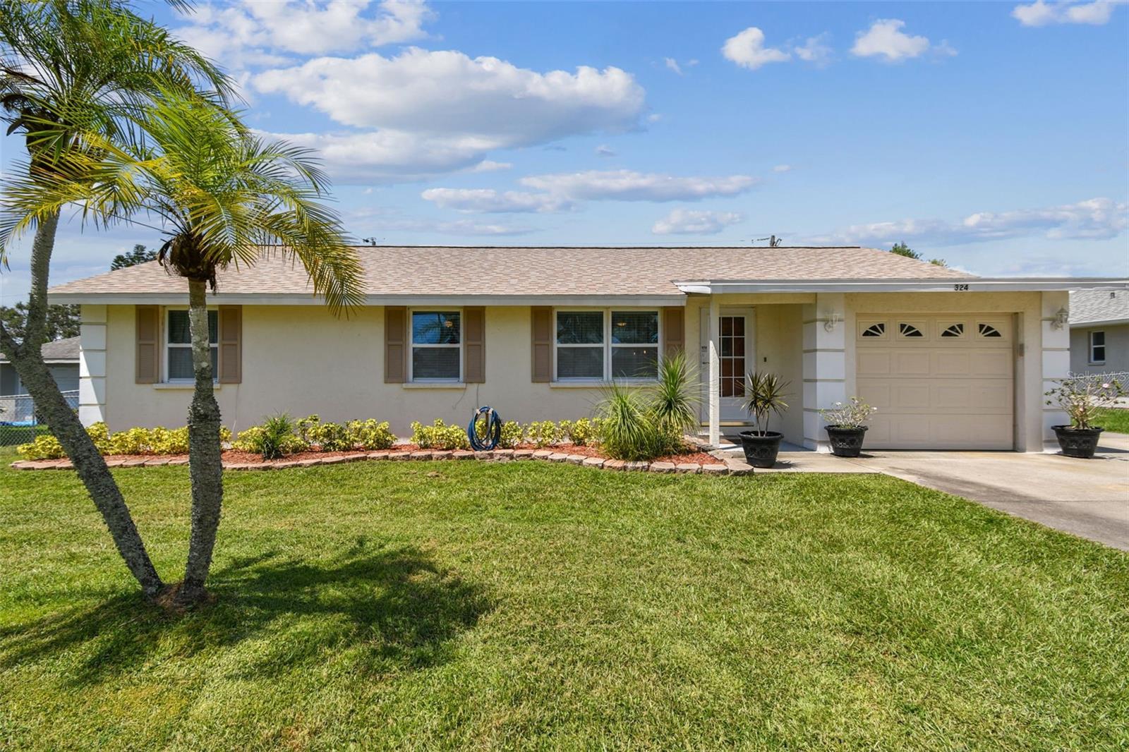 *** Multiple offers received. Highest and Best due by Wednesday, August 27, 2025 at 5:00PM. *** Picture perfect and ready for you with a water view! Adorable and beautifully maintained, this 3 bedroom 2 bath home in the ever popular Palmetto Point is now available. Coastal living yet flood insurance is not mandatory with a mortgage, and no damage from the storms of last year, this updated home offers peace of mind with its double-pane windows and laminate flooring for easy maintenance. The spacious open living room flows seamlessly into an ample dining area and a beautifully updated kitchen with wood cabinets and appliances that are just two years old. You'll love relaxing on the back screened-in lanai, which offers a gorgeous lake front view and a large fenced back lawn. With no HOA and no deed restrictions, it's perfect for your boat, jet skis, and all of your outdoor toys. Recent updates include a new roof (2023), a new air conditioner (2022), and a new hot water heater (last year). A community boat ramp is conveniently located nearby, with membership available for a nominal fee. This home is centrally located, offering very easy access to I-275 and I-75, and is just a short drive to St. Pete, Tampa, Bradenton, and Sarasota, perfect location for commuters. Calling Zillow and other 3rd party sites will not connect you to us. So call us direct.