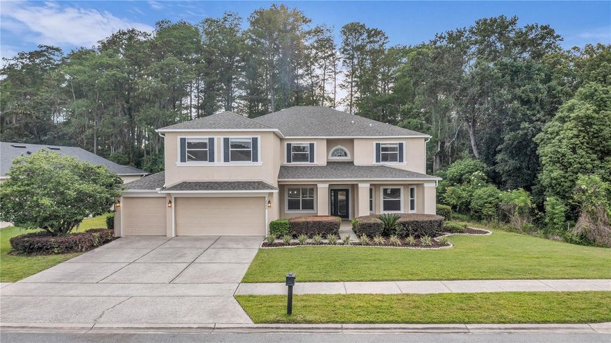 Nestled in the sought after gated community of Wintermere Pointe in Winter Garden, this beautifully renovated residence offers a serene and private retreat with a truly like new feel. Situated on an oversized lot backing to conservation, with no neighbors on one side and located near a cul de sac, this home delivers exceptional privacy and peaceful surroundings. The entire home has been thoughtfully remodeled from top to bottom, creating a fresh, modern ambiance throughout. Updates include a brand new roof, luxury vinyl plank flooring, fresh interior paint, and all new contemporary lighting and finishes. The newly designed oversized kitchen showcases 42" soft close cabinets, quartz countertops with built-in technology charging port, modern tile backsplash, under cabinet lighting, brand new stainless steel appliances, center island and breakfast bar. The open concept layout flows seamlessly into a breakfast nook and a spacious family room, where large sliding glass doors open to a covered rear patio extending the full length of the home, overlooking tranquil conservation views. A two story foyer welcomes you upon entry, flanked by an airy formal living room and dining room along with a double access stairway. The first level also features a spacious bedroom with French door access, offering split living for enhanced privacy, perfect for guests, multi generational living or a home office. Upstairs, an open loft anchors the second floor, creating a desirable split plan with bedrooms positioned on either side. Sliding doors lead to a covered second level providing serene conservation views. The vast primary suite features tray ceilings, private balcony access, dual walk in closets, and a completely redesigned ensuite bath offers a luxury feel with dual quartz vanities, LED lighted anti-fog mirrors, glass enclosed tile shower, and a statement soaking tub. Three additional bedrooms are situated on the opposite side of the loft, along with a hallway bath featuring a double vanity and modern tiled tub/shower combination. Completing the second level is an expansive bonus room, perfect for a theater, recreation space, or home gym - endless flexibility. This exceptional home combines serene surroundings, modern upgrades, and a like new feel, all within one of Winter Garden’s premier communities, close to multiple shopping and dining options, FL-429 and just 20 minutes from Disney attractions. Don't miss out! Schedule your viewing today!