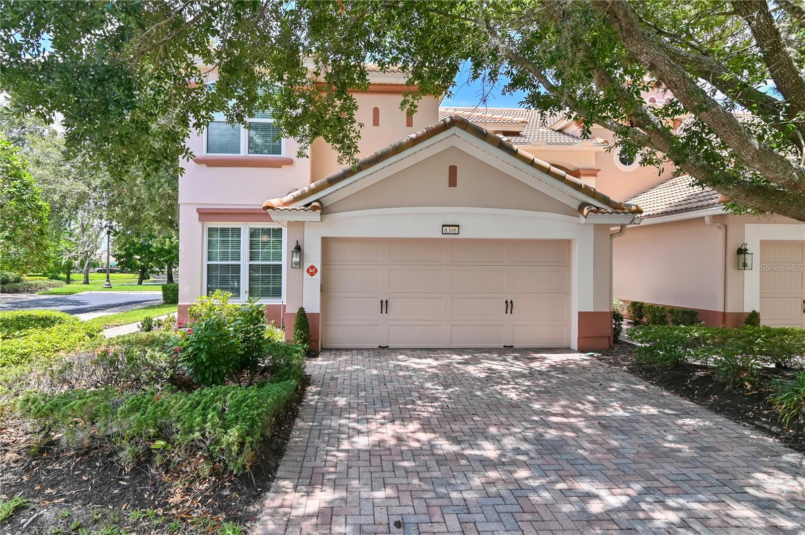 WATER VIEWS! This RARE Mirella (END UNIT) has been lightly used as a SECOND HOME. Featuring 3 bedrooms, 2.5 baths, large LOFT, and 2 CAR GARAGE. This townhome-style condo is located in the GUARD GATED, resort style community of BellaTrae. This highly UPGRADED home features LUXURY laminate FLOORING, NEWER WINDOWS, a GROUND FLOOR MASTER with UPDATED MASTER BATH, dual sinks, and HUGE WALK-IN SHOWER. The master CLOSET has BUILT-IN SHELVING/DRAWERS. There is also a DOWNSTAIRS, UPDATED half bath for guests. The 2nd floor includes a large, open LOFT (Sectional included), flex area, as well as 2 upstairs bedrooms which share a spacious UPDATED 2nd bath including DUAL SINKS. Every bedroom has a CEILING FAN and the 3rd bedroom includes a custom BUILT IN MURPHY bed! The kitchen includes custom PAINTED CABINETS, GRANITE COUNTERS, NEWER STAINLESS STEEL APPLIANCES, and breakfast nook. Also includes DOWNSTAIRS LAUNDRY ROOM. Enjoy sitting in your screened TILED lanai (with NEWER heavy SLIDERS and AUTOMATIC SHADES) overlooking the peaceful WATER VIEWS. The community includes a PRIVATE CLUBHOUSE with amenities such as a BILLIARDS room, LIBRARY, multi-purpose spaces, and State of the Art FITNESS CENTER. Outdoors you can take pleasure in Florida's year round sunshine at the HEATED POOL/SPA, TENNIS/PICKLE Ball COURT, and PUTTING green. There is a full time Lifestyle director on site. BellaTrae offers GUARD-GATED privacy and low-maintenance living. Exterior building maintenance and exterior insurance, basic cable, internet, pest control, and lawn care are included in the HOA fees. Furniture included in sale are the sectional sofa in the loft, the black kitchen dining table with 8 chairs, bedroom suite in upper corner bedroom, the garage fridge, and 2 storage cabinets in garage. Have peace of mind with a 1 yr Shield Essential HOME WARRANTY with AHS.com. This unit will not last long so schedule your showing today!