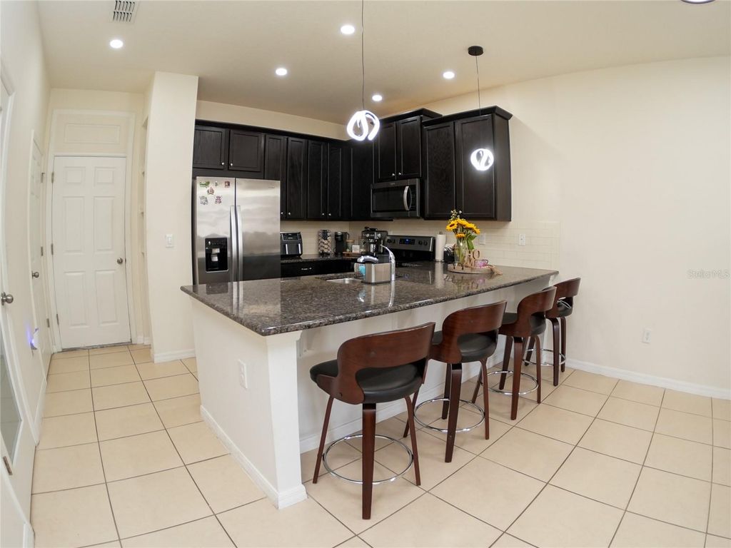 Photo of 2451 Varenna Loop, Kissimmee, FL 34741 (MLS # O6376503)