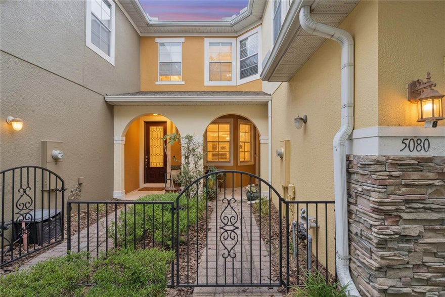 BEAUTIFULLY APPOINTED 3-BEDROOM TOWNHOME IN A QUIET GATED COMMUNITY.  Welcome home to this thoughtfully designed two-story townhome located in the desirable, gated community of Clayton Crossing Townhomes.  Ideally situated just minutes from the 417, this home offers convenient access to destinations east and west while maintaining a serene neighborhood setting.  Driving through the community under a canopy of mature oak trees, you arrive at 5080 Cypress Branch and are welcomed through a private, gated courtyard and recessed entry, creating an inviting and secure first impression.  Step inside to the main level which features a bright, open-concept layout where the kitchen, living and dining areas seamlessly connect – perfect for everyday living and entertaining.  The spacious kitchen is a standout, featuring granite countertops, 42-inch upper cabinets, a closet pantry, and an L-shaped, raised breakfast bar ideal for casual dining or gathering with guests.  A convenient powder room is also located on the first floor, along with a versatile bonus space that can serve as a home office, computer station, or cozy breakfast nook.  Upstairs, the split-bedroom floor plan provides privacy and comfort.  The generous primary suite offers a large walk-in closet and a well-appointed en suite bath with dual sinks, a soaking tub, separate walk-in shower, and private water closet.  Two  additional bedrooms and a full bath complete the second level.  The laundry closet with full-size washer and dryer is conveniently located upstairs, making daily living even more functional.  There is also an under-stairs storage closet in the garage for those things you don't want to store inside.  Clayton Crossing offers the perfect combination of comfort, style, and low-maintenance living, including a sparkling community pool and a tot lot for the little ones.  Groceries, pharmacies, and eateries are within minutes.  Note:  Enjoy peace of mind knowing that the roof is only one month old, and the upgraded Carrier HVAC system is only six months old.  Come see this one before it is gone!