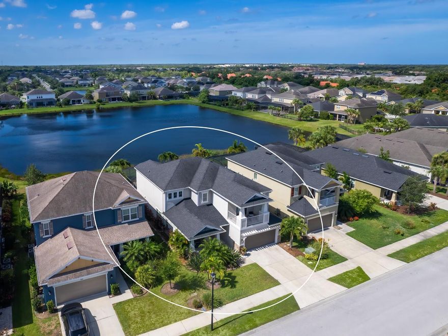 Welcome home to this stunning Eden model nestled on a beautifully landscaped lot with gorgeous lake views in one of the most sought after family friendly communities of Arbor Lakes on Palmer Ranch.  This exceptional 4-bed, 3.5 bath with a flex room, office and loft area offers 3,487 sqft of luxurious living space, completed w/ an impressive $100,000 of upgrades.  In addition to the upgrades throughout, the backyard is highlighted w/ a custom heated 14x28 saltwater pool w/ a sundeck entrance and a sitting area perfect for entertaining, this home truly is an entertainer's paradise! Located in a community known for its highly rated schools, this home has been rezoned for the new state-of-the-art Skye Ranch School K-8 and is only 15 minutes to Pine View School for the gifted, offering exceptional educational opportunities. Once you enter the home you will be greeted with a beautifully laid out and stunning wood plank tile flooring that leads you straight to the heart of the home featuring a Gourmet Chef's kitchen with sliders opening up to the relaxing enclosed pool area. The kitchen features 42' cabinetry, a beautiful large kitchen island, stainless steel appliances, a built-in oven and microwave, under-cabinet lighting, a tile backsplash, and a convenient pantry w/ a designated eat-in kitchen space.  The high ceilings and custom built-in fireplace w/ mantle on the media wall in the great room creates a cozy yet luxurious ambiance, perfect for hosting guests or enjoying a quiet evening at home. The downstairs has a designated dining room, flex space and office which makes working from home convenient w/ ample space. As you walk up the beautiful and timeless hardwood staircase to the second level you will find a generous sized loft area perfect for a children's playroom or additional living space. The second level includes a beautiful primary bedroom w/ an ensuite bathroom, 2 bedrooms w/ a Jack and Jill bath updated w/ vanity, mirror and shower doors and a guest bedroom with its own ensuite bath.  The primary suite has been thoughtfully designed with a classic second level porch perfect for morning coffee or afternoon reading, en-suite bathroom with a soaking tub, walk-in shower, his and hers sinks and walk-in closets. After a long day of work or school, dive into relaxation with a custom heated 14x28 saltwater pool.  The carefully designed pool area is equipped with a 400K BTU gas heater, two relaxing water bowl features with a 24" sheer descent waterfall, sundeck entrance with a built-in table, sitting area inside the pool and the outdoor kitchen is plumbed and ready to be designed and added. The pool area is the perfect summer retreat and great for entertaining all while being surrounded by newly added private landscaping enclosed with a new wrought iron fence w/ two gates perfect for children and pets to run and play while adding peace of mind.  The home is equipped with alarms on the doors for the pool area, pest control system in walls and hurricane shutters fitted for the entire home.  Arbor Lakes is gated at one of the two entrances and is located in the top rated school districts, low HOA and no CDD fees and is conveniently located to downtown, shopping, restaurants and is 15 minutes to the world famous white sandy beaches of Siesta Key. The fun-filled community includes a pirate playground, resort style pool, spa, splash park, volleyball, basketball, dog park, designated fishing areas and a gas fire pit for hours of endless fun.