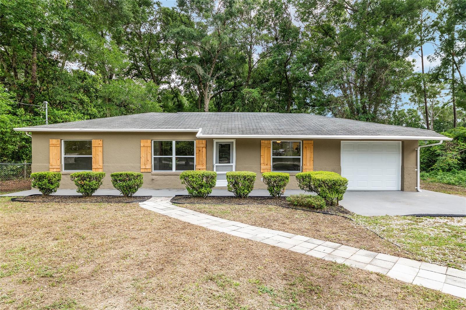 Tucked away in the heart of Belleview, just minutes from top-rated schools, shopping, and everyday conveniences, this charming home offers not only a warm and welcoming atmosphere—but also a smart, secure investment in your future. Step outside to your spacious backyard oasis, where evenings are best spent around the in-ground fireplace, laughing under the stars or enjoying a quiet, cozy night by the flames. The back deck is perfect for weekend barbecues, morning coffee, or simply soaking in the peace and privacy that surrounds you. Inside, you'll find a home filled with light and potential—ready to match your vision. Whether you're starting a new chapter, growing your family, or simply looking for a place that feels right, this property delivers comfort, value, and a location that continues to grow in demand. With its unbeatable mix of location, outdoor charm, and long-term appeal, this is more than just a home—it’s a lifestyle you’ll love and a foundation you can count on. Don't miss your change to own your slice of paradise! Schedule a showing today!
