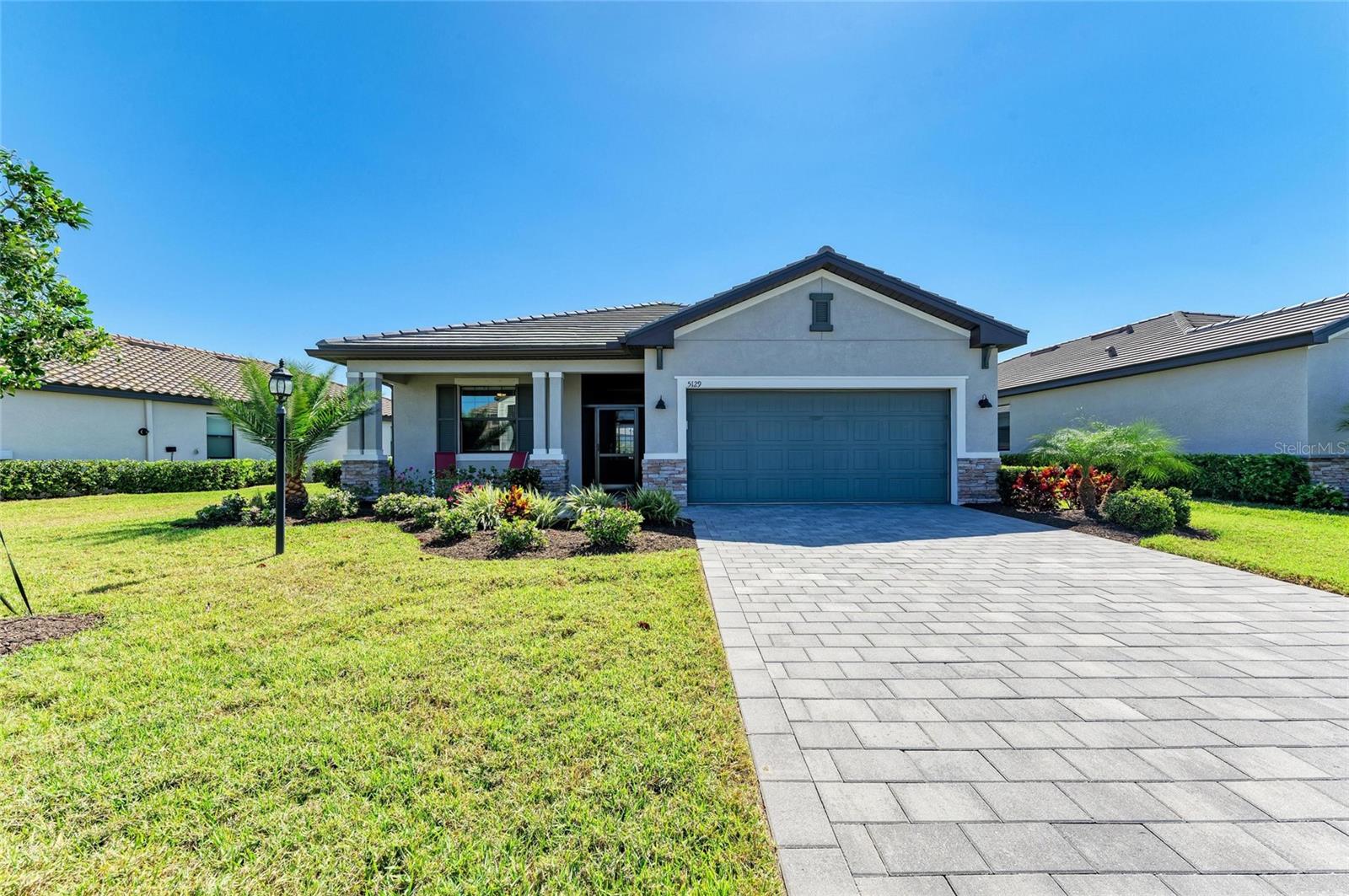 Check out the PRIME TIME DEAL! ! 30k price improvement ! Bring Offers!!Welcome to Lorraine Lakes, the premier community in Lakewood Ranch! Why wait for new when this home is ready and meticulously upgraded. This stunning home offers 1,849 sq. ft. of thoughtfully designed living space, featuring 3 bedrooms, 3 bathrooms, and breathtaking water views on a quiet cul-de-sac with lush all around landscaping.
The split floor plan ensures privacy, while the open-concept design seamlessly connects the dining room, kitchen, and family room—perfect for modern living. A large glass sliding door leads to the 18 x 8 covered lanai and extended 25 x15 lanai with marble tile, creating an effortless indoor-outdoor flow for entertaining. Enjoy phenomenal west-facing views from the front yard, where stunning sunsets paint the sky each evening.
Freshly painted throughout with designer paint, all new Stainless Steel Appliances, and washer and dryer included. The gourmet kitchen features a huge island with quartz counters, breakfast bar and walk-in pantry. Each bedroom has its own bathroom for easy living. The newly enclosed front porch keeps out those pesky bugs. The epoxied garage floor offers several benefits that enhance both the functionality and aesthetics of your space. Enjoy the added convenience of generator hook up.Living in Lorraine Lakes means access to resort-style amenities, including a resort pool, lap pool, splash pad and Tiki Bar, hot tub, an indoor basketball court, a fitness center, putting green, Coffee Bar, Shuffle Board, Beach Volleyball, Arcade, sports courts, Bocce Ball, a playground, and scenic walking trails. Plus, the community’s on-site bar and restaurant add an extra touch of convenience.
With top-rated schools, Waterside Place, UTC Mall, and Siesta Key Beach just minutes away, you’re never far from world-class shopping, dining, and entertainment. The low HOA fees include lawncare, irrigation, cable TV/Internet and all the fabulous amenities.
This home perfectly blends luxury, comfort, and convenience in one of Florida’s most sought-after communities. Don’t miss out—schedule your private showing today and experience the ultimate Lakewood Ranch lifestyle! (CDD included in taxes)