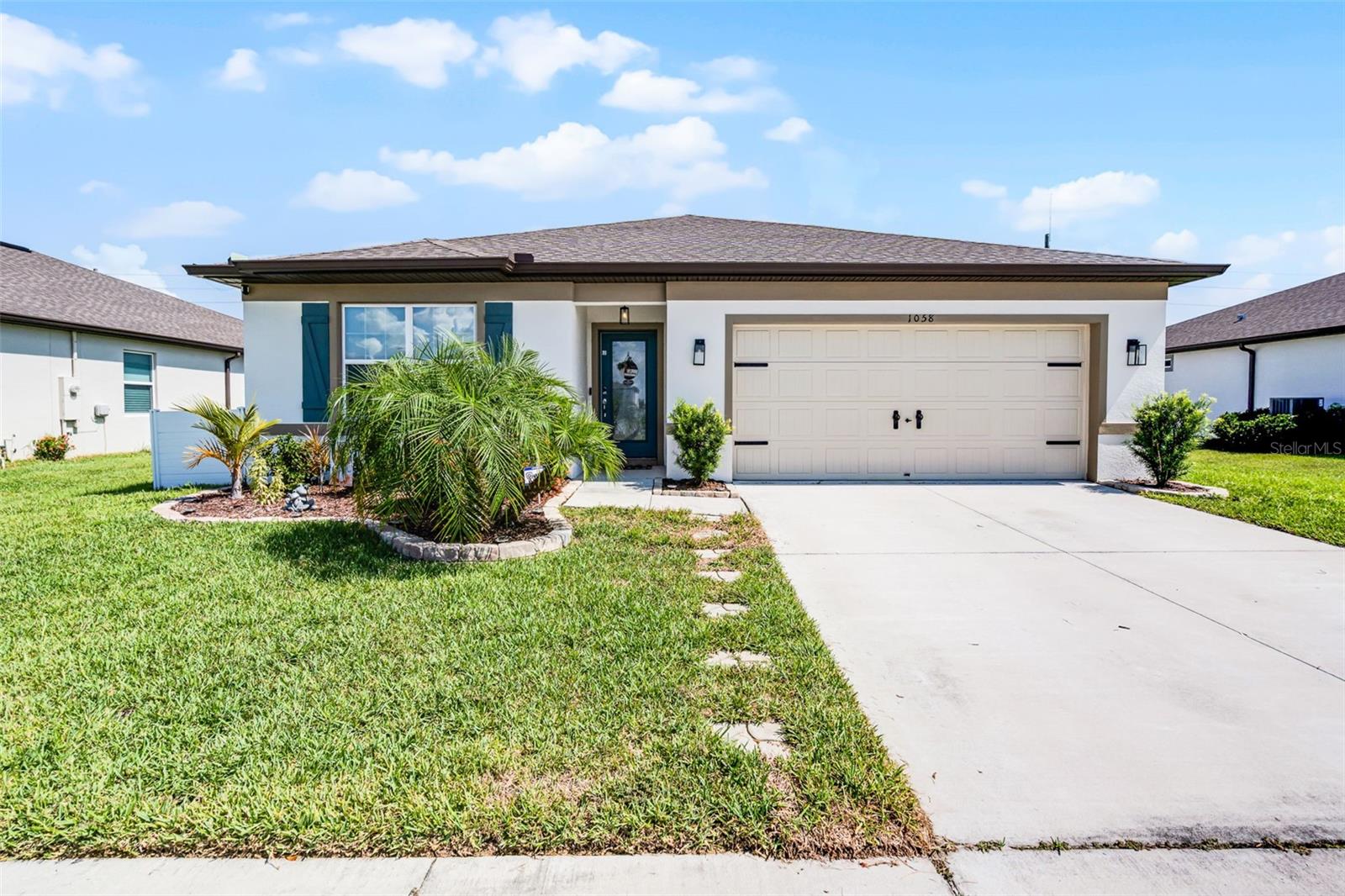 Welcome to this beautiful 4 bedroom / 2 bathroom / 2 car garage home in Winter Haven! With just under 2,000 SqFt of living space, this home was BUILT IN 2022 and has plenty of features throughout! Walking up to the property, you'll immediately be greeted by the well landscaped yard with tropical landscaping. The home has an OPEN FLOOR PLAN with tiled flooring throughout the main living areas and a huge great room space, perfect for entertaining! The kitchen features a a spacious center island, granite countertops, stainless steel appliances, tiled backsplash, and plenty of cabinetry space. Some of the custom upgrades include upgraded light fixtures, feature walls, and added cabinetry in the laundry room. All of the bedrooms are spacious and have been upgraded with luxury vinyl plank flooring. The backyard is generously sized and is FULLY FENCED! Other features back here include a screened patio and additional large pavered seating area, perfect for creating your own private oasis! There is plenty to do in the area with nearby restaurants, shopping, parks, coffee shops, breweries, just to name a few! The theme parks are located nearby as well, with Legoland only a few minutes away and Disney / Universal Studios under an hour away. Call now for your private showing!